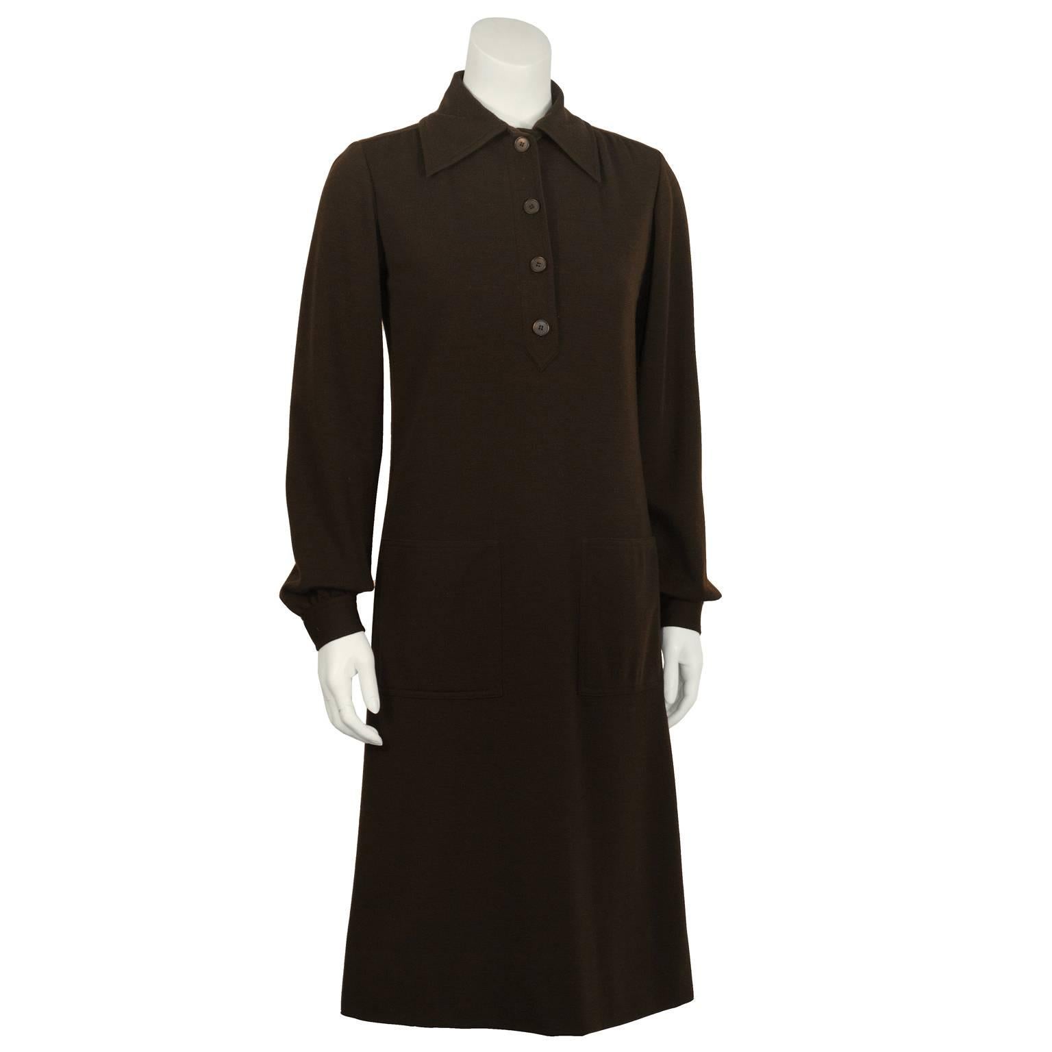 Adorable 1970's Yves Saint Laurent day dress.  Dark brown wool, featuring a wide collar, front button up, two patch pockets, and long sleeves with slight gathering at the cuffs. An amazing piece for transitional weather! Excellent vintage condition.