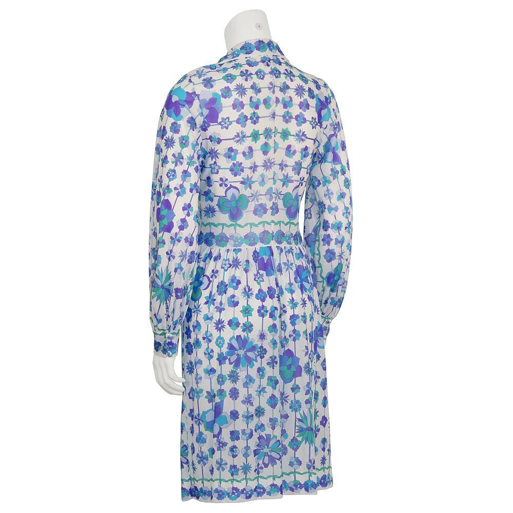 Perfect blue and green nylon floral printed cover up by Emilio Pucci for Form Fit Rogers from the 1970's. The top does up the front with simple white buttons and the all over floral pattern is carried on to the collar and cuffs. This tunic goes well