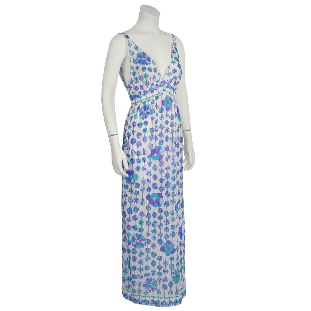This blue and purple floral printed nylon slip dress is Emilio Pucci for Form Fit Rogers and is the perfect summer dress. Featuring a deep V neckline and banded empire waist, this dress would look perfect thrown on with sandals and a classic jean