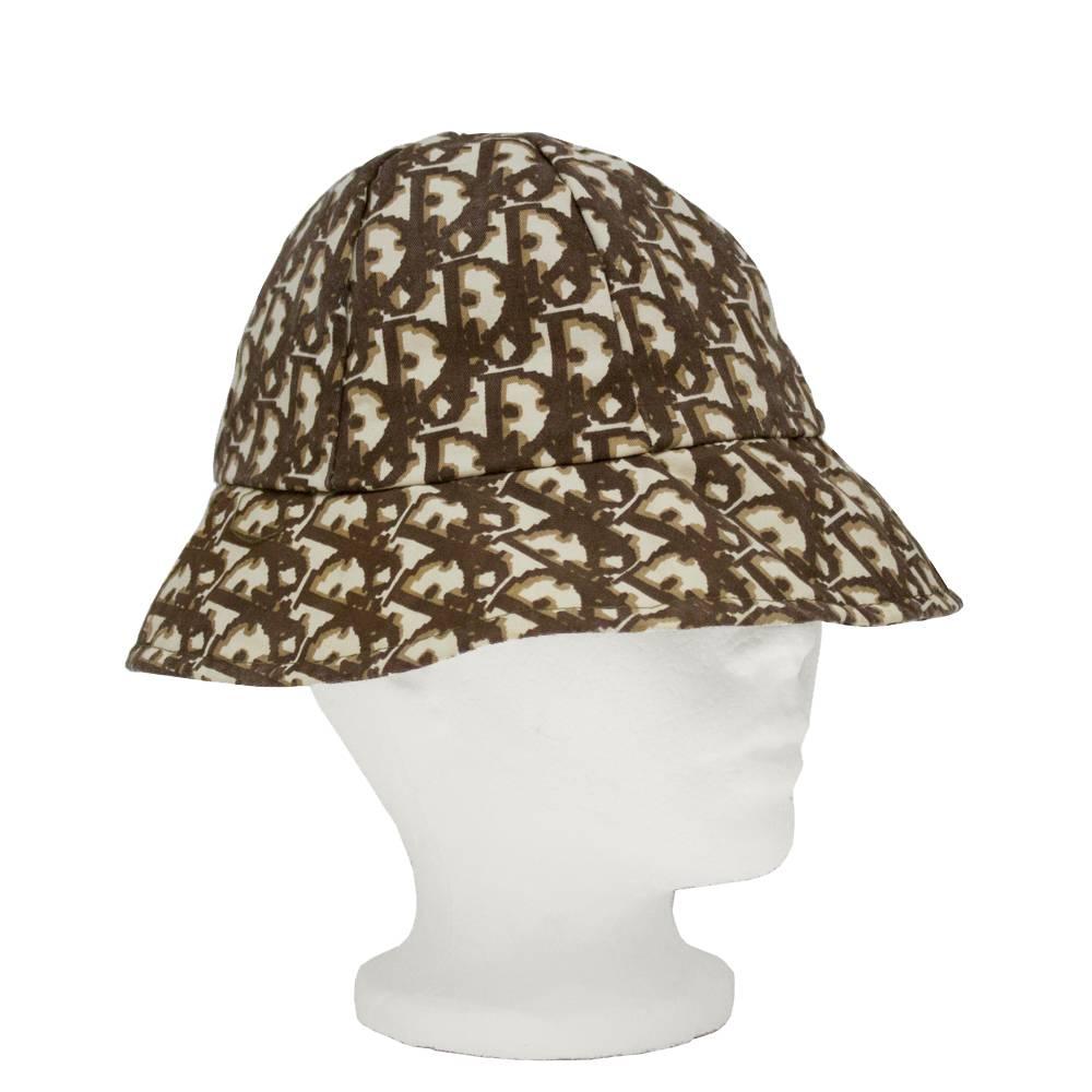 Christian Dior cotton and polyester bucket hat from the 1970's original logo fabric issue with the signature monogram print throughout in brown and cream. Excellent vintage condition. Size small. Circumference 21.5”
