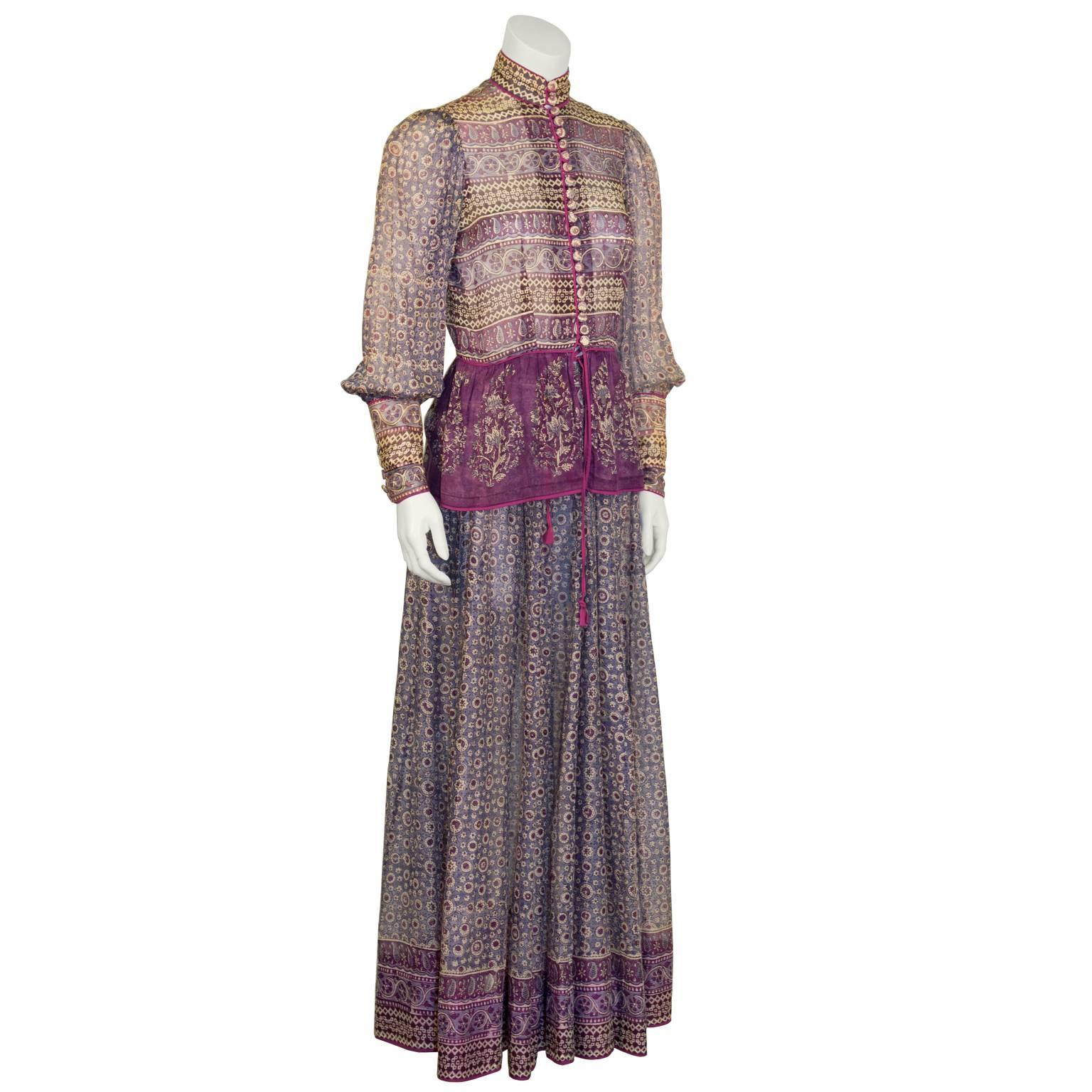 Hippie chic 1970's UK label Anokhi semi-sheer block print Indian cotton top and skirt ensemble. Long sleeve blouse has a band neck, front button fastening with several fabric covered buttons, and finishes with a soft peplum opening. Great romantic