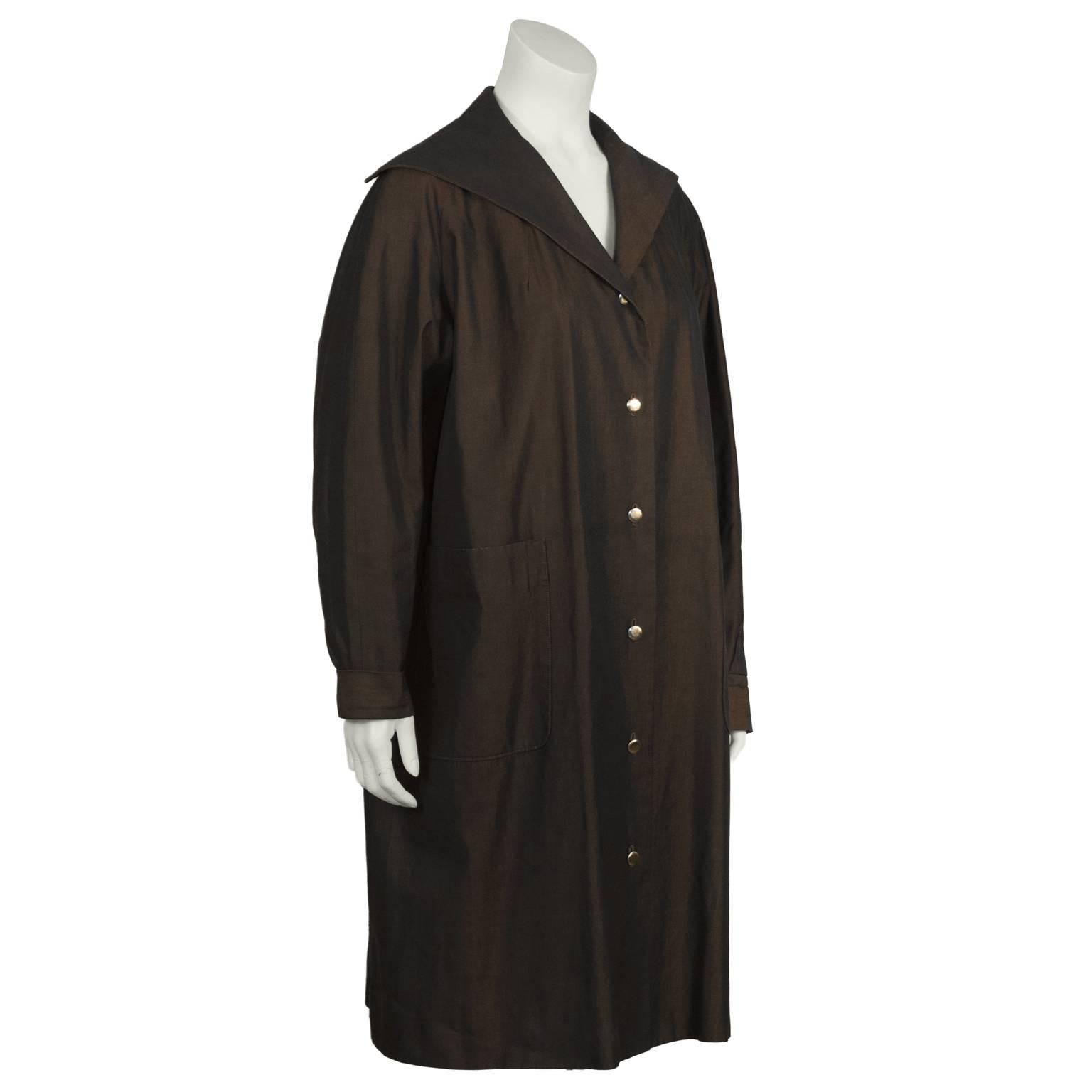 1950’s brown Schiaparelli overcoat from her licensed label with front patch pockets and a sailor style collar. The slightly iridescent fabric gives off the perfect amount of sheen to make this coat suitable for day or evening wear and the gold
