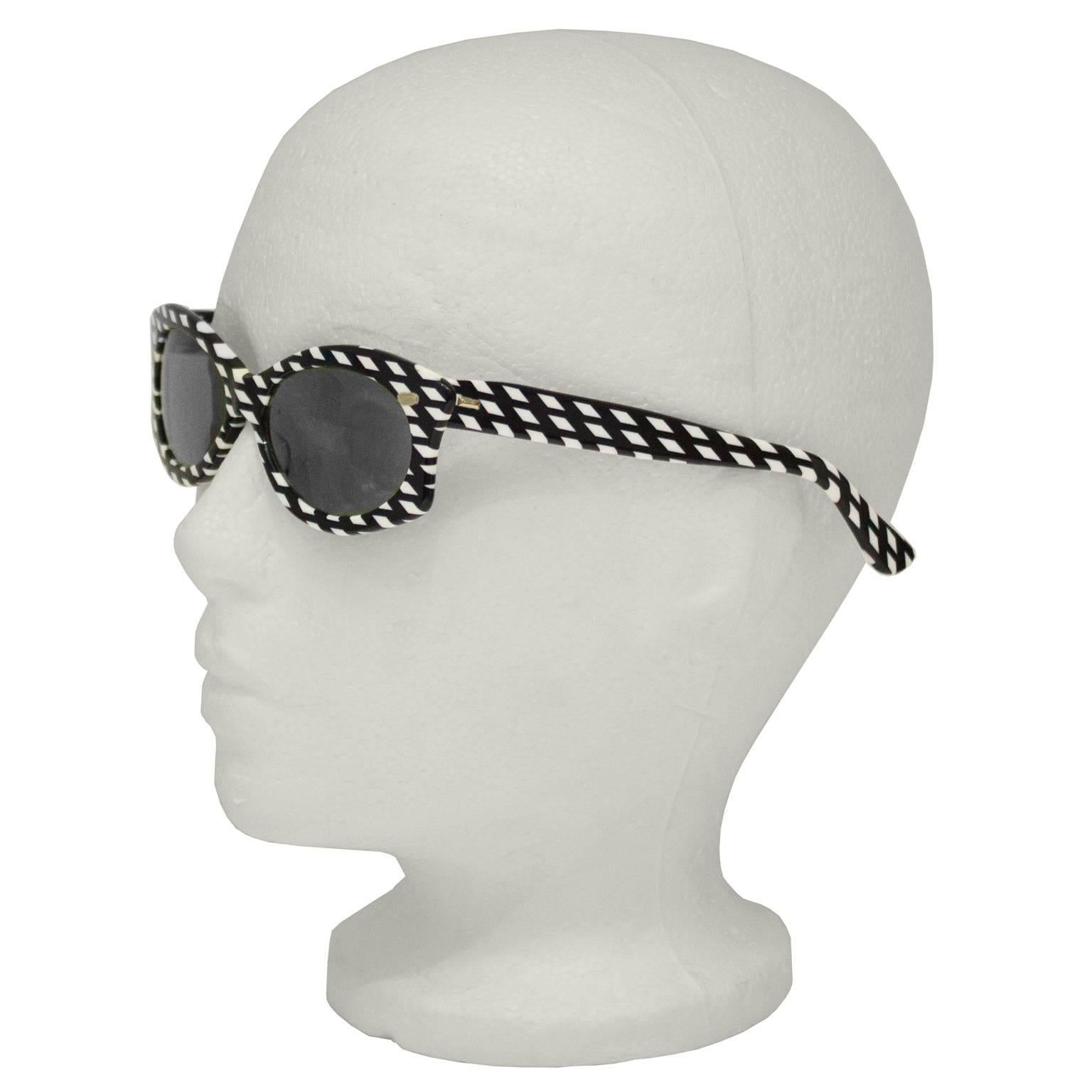 Attributed to Auguste Bonaz 1960's Op Art black and white geometric pattern sunglasses. Shape is a mix between a cat eye and wayfarer and the original lenses are non prescription. In excellent like new condition. 