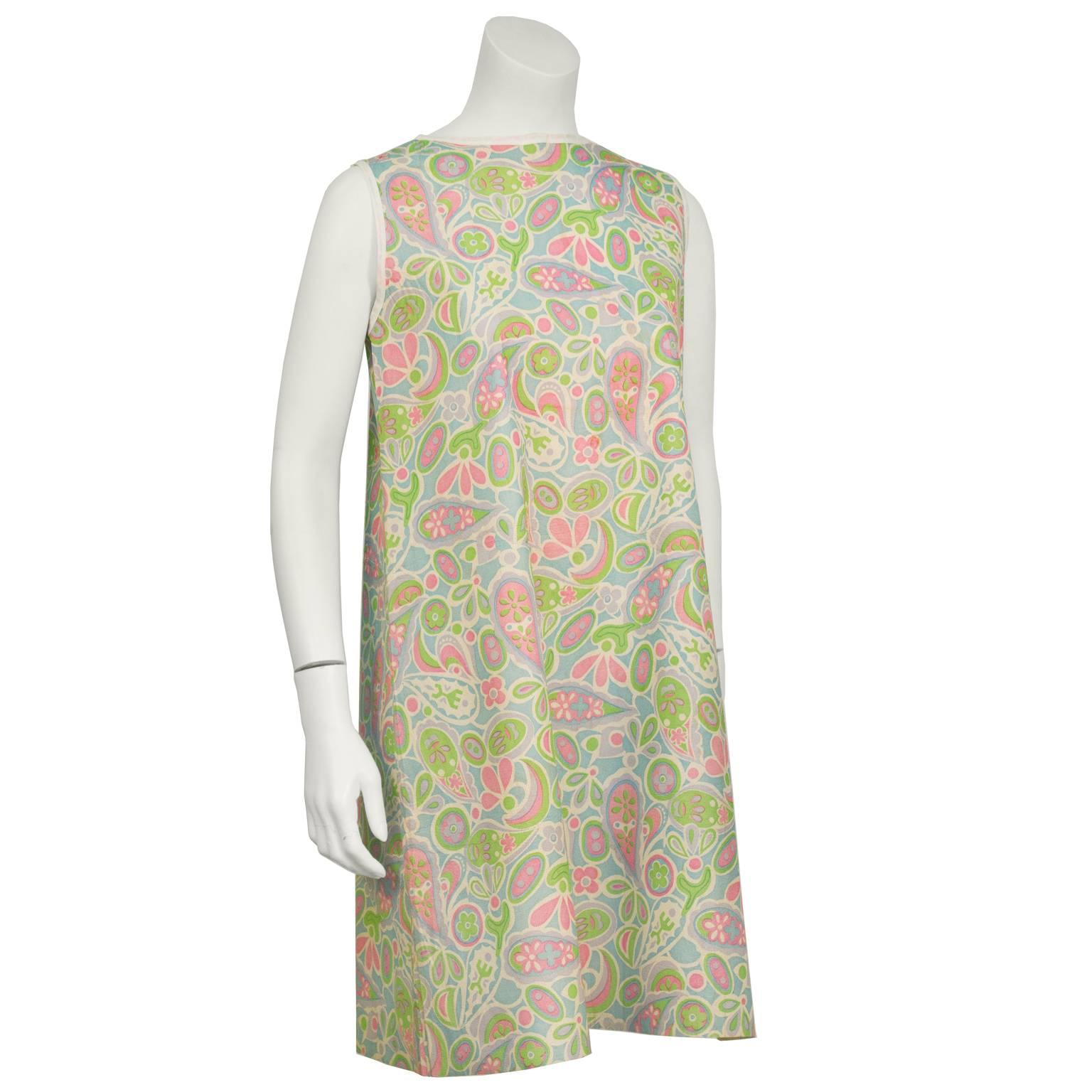 1960's iconic mod paper dress. Allover pastel mod paisley print. Sleeveless with an A-line cut. Cotton fabric banding at arms and neckline. Slight fade throughout. In very good vintage condition. A real collectors item. Fits like a US size 4-6.
