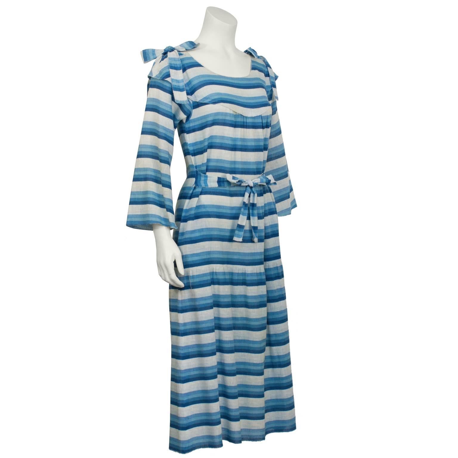 1970's Sonia Rykiel boho blue striped peasant dress. Drop waist style dress features pockets at the hips and a narrow belt that can be done up in the front or back. Yoke style neckline finished with straps that can be tied in bows at the shoulders.