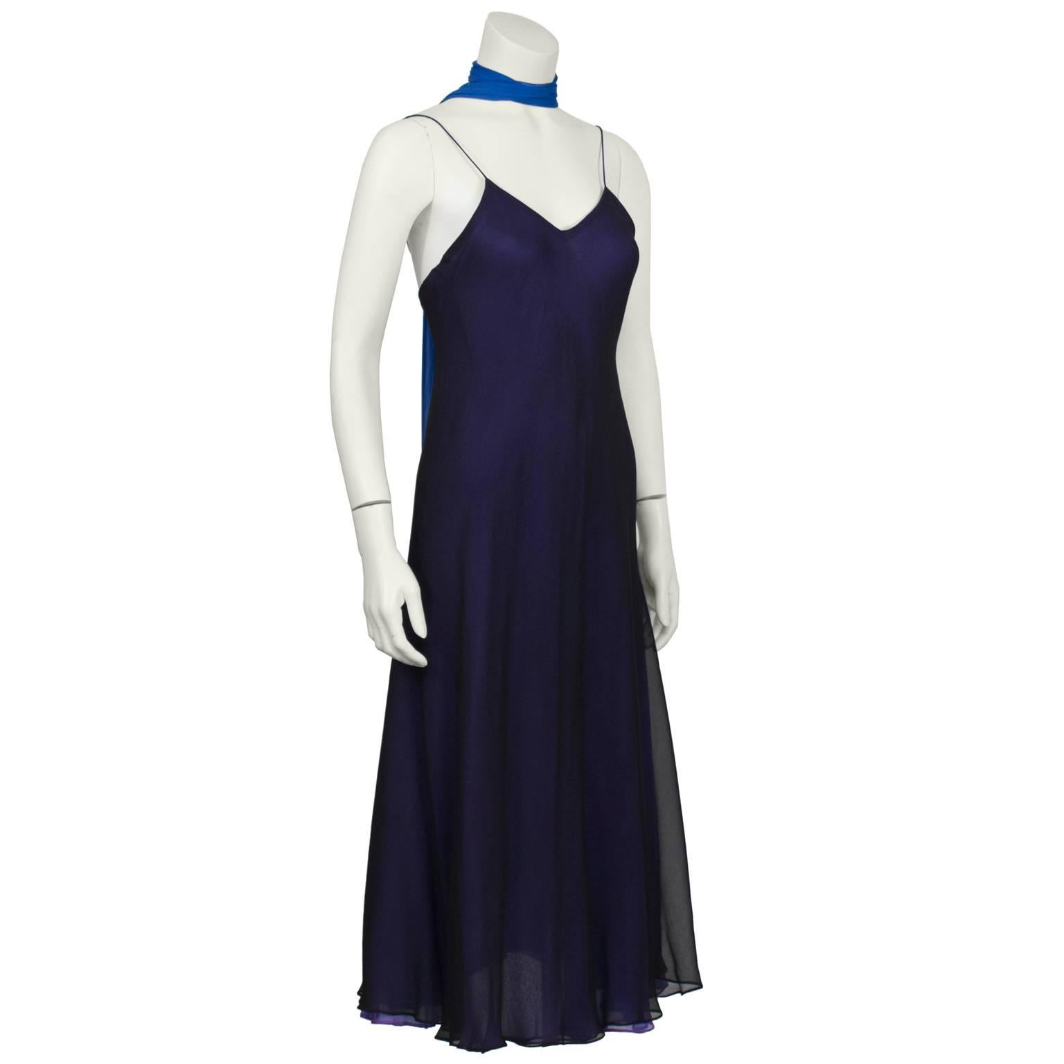 1970's George Stavropoulos bias cut navy triple layer chiffon slip dress. Purple and royal blue under layers add dimension to the top navy layer. Matching royal blue sash can be worn as a belt or necktie. Narrow rolled hem finish creates a slight
