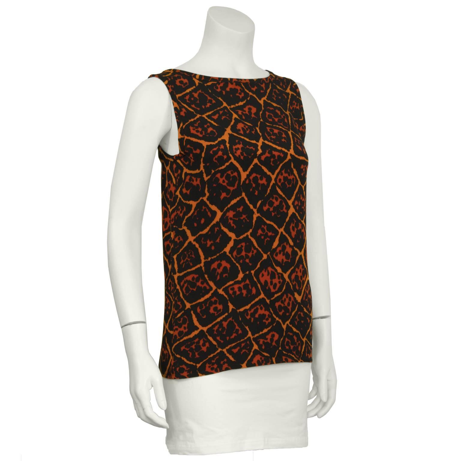 1980's Yves Saint Laurent leopard print silk tank top. Simple wide strap tank has a scoop neck, and an allover leopard print in tan, amber and black. Excellent condition. Fits like a US size 4-6.
