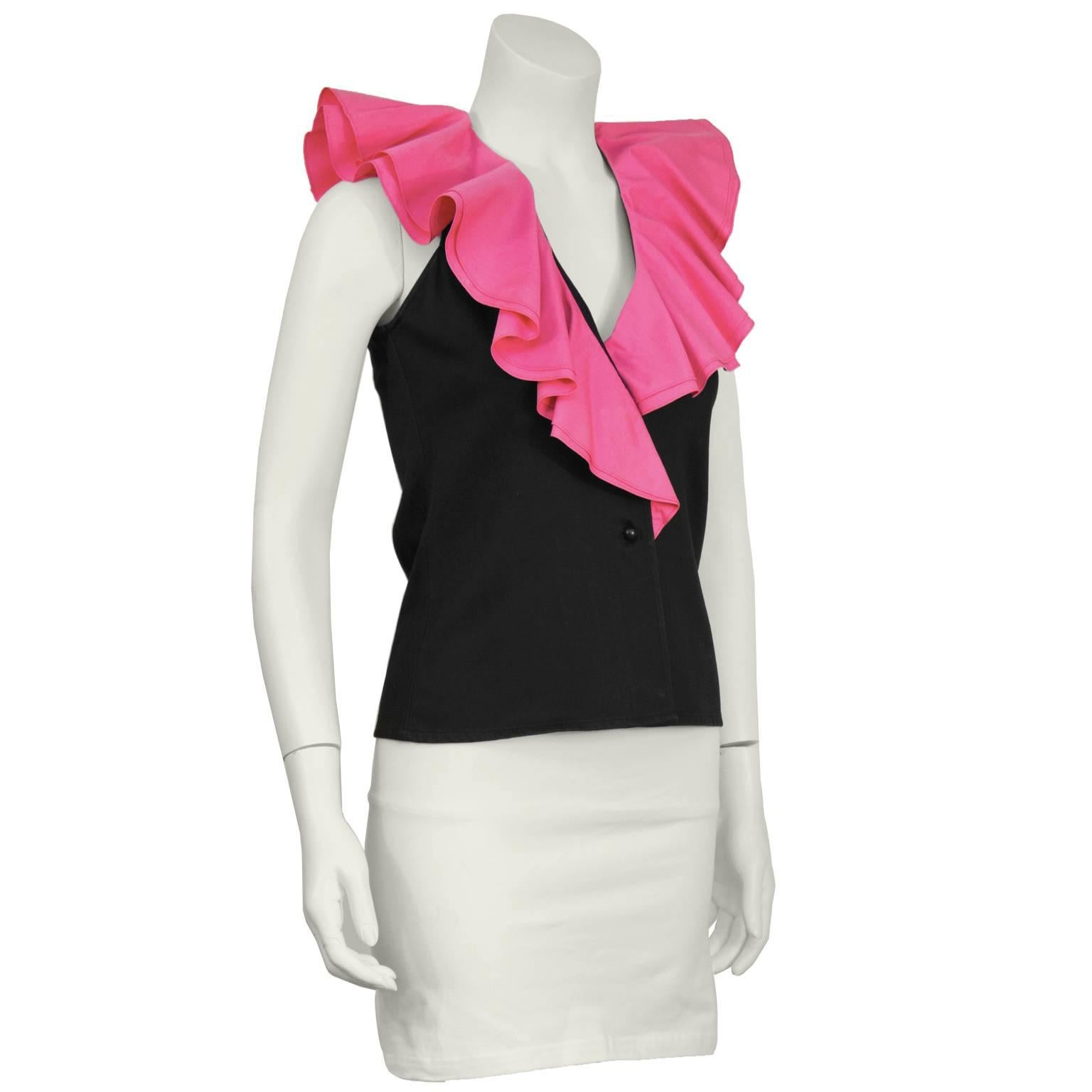 1980's Yves Saint Laurent black sleeveless fitted top with ruffles. Black cotton vest top has vibrant double layered pink ruffles cascading to the middle of bodice. Excellent condition. Fits like a US size 2-4.