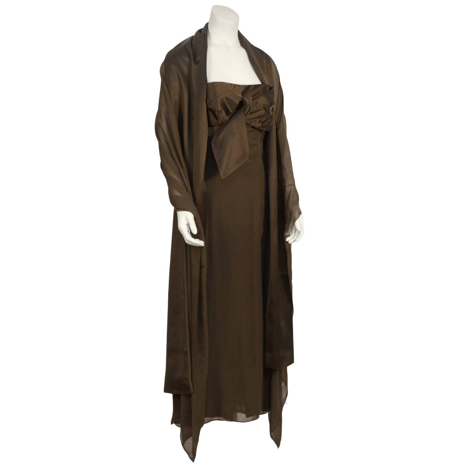 Lanvin brown evening gown from the 1950's. The empire waist dress features spaghetti straps and a fitted satin bodice with an oversized bow on the front. Zipper up the side. Excellent vintage condition. Matching satin and chiffon wide shawl. Dress