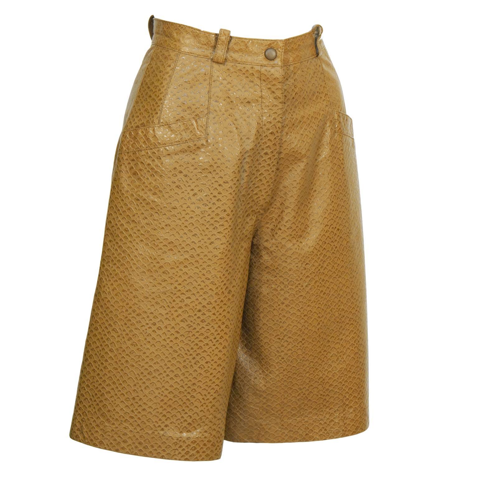 Krizia tan pigskin culottes from the 1980's. The cropped faux python pattern culottes feature a waistband with belt loops, two band pockets at the hips and closes with a zip fly. Interior is lined in tan chiffon. Excellent condition. Fits like a US