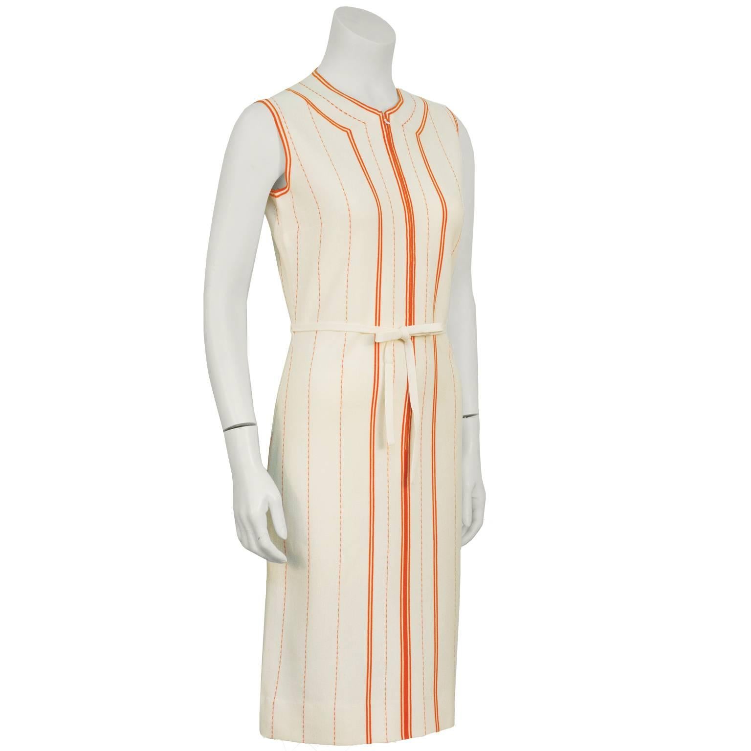 GIna Paoli, Italian super star manufacturer of wool knits mod dresses in the 1960's fabulous unused beige and orange wool knit dress with belt. The sleeveless  collarless dress zips up the front and has a matching beige belt that ties at the waist
