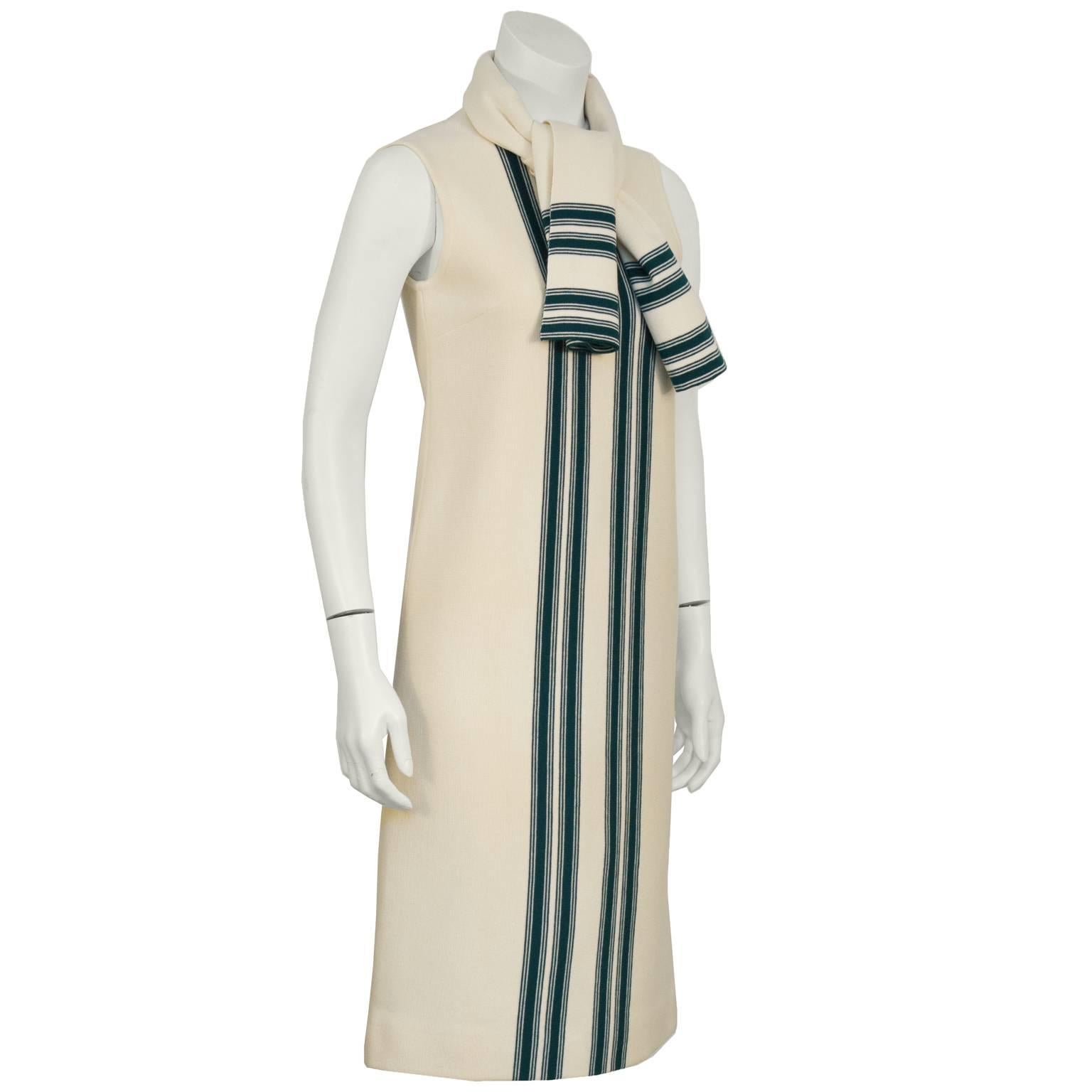 Italian 100% wool knit sleeveless dress from the 1960's. The cream dress features a vertical green stripe pattern down the front, darts at the bust, and zips up the back. Comes with a matching  scarf. In excellent condition. Fits like a 4-6. In new