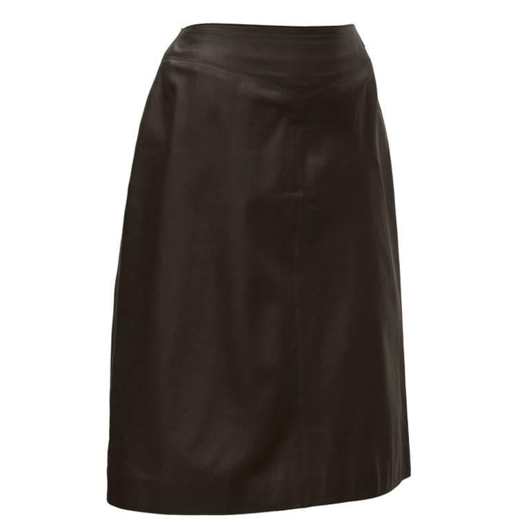 Chanel dark brown leather skirt from Spring 1999. Buttery soft skirt features a stitched yoke style waistband with a seam down the front and a small Chanel metal tag on the left hip. Zipper up the back. Fits like a US 4-6. In excellent condition. 
