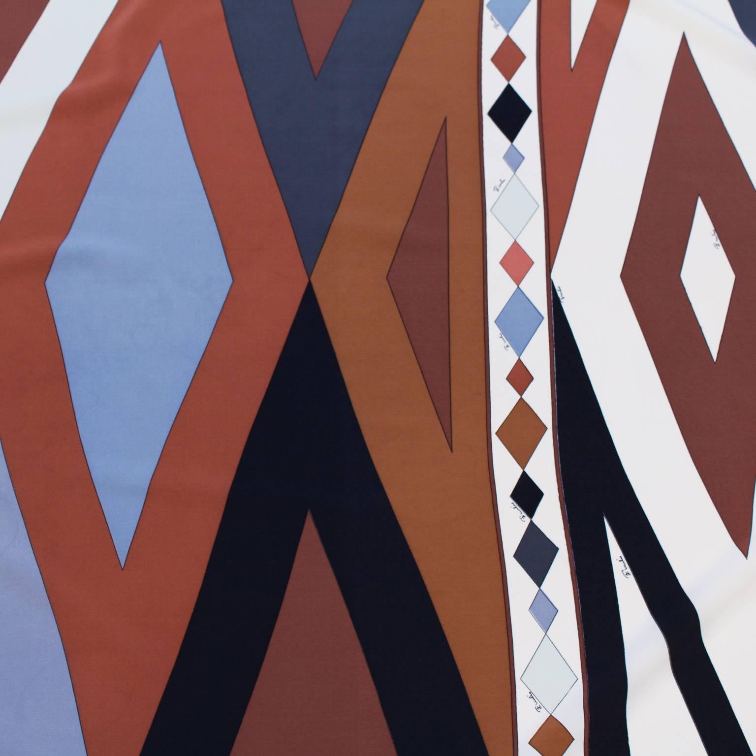 Emilio Pucci silk scarf from the 1970's featuring a geometric print in browns, grays, black and white. Signed Emilio Pucci throughout, very minor stains. In excellent condition. Measures 34