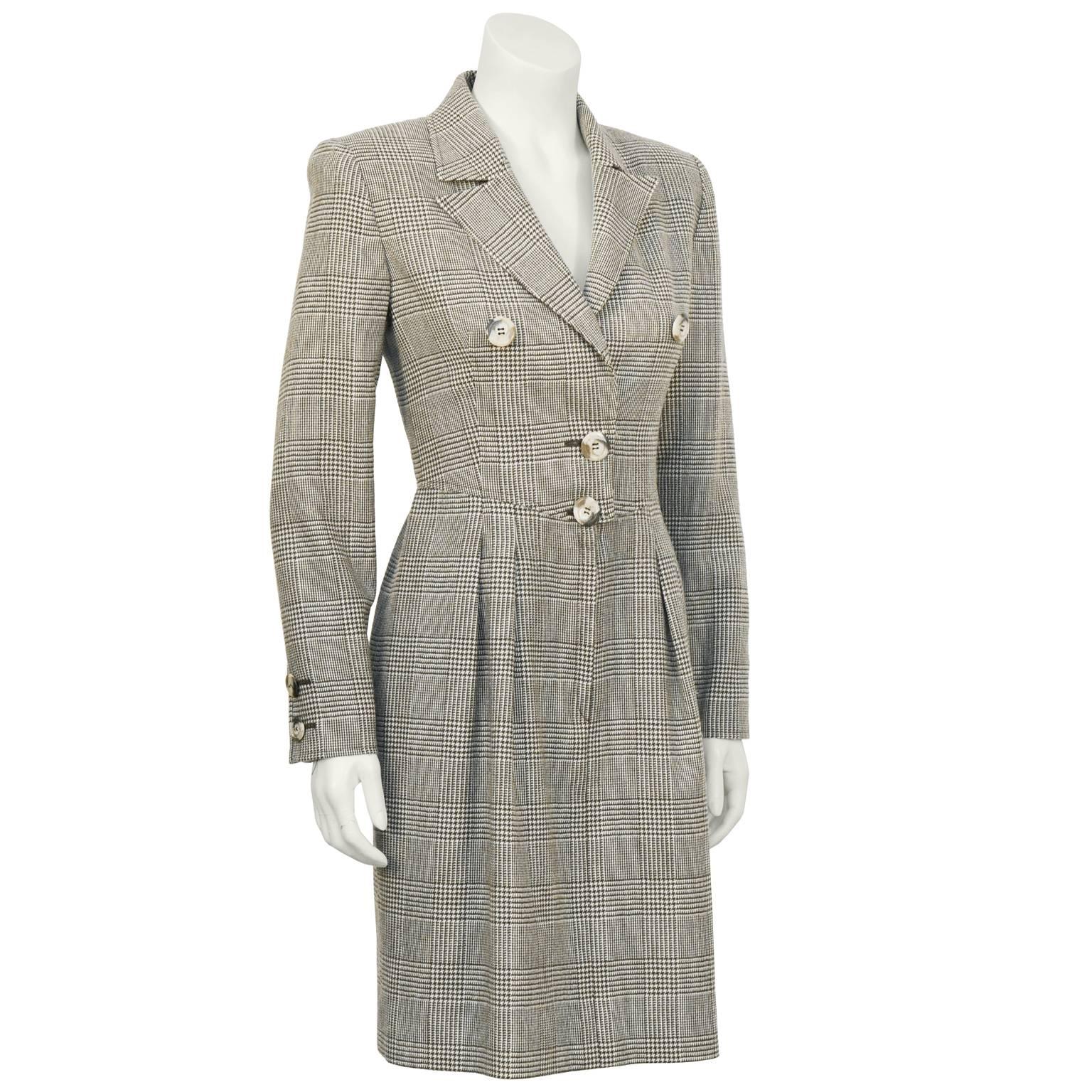 Valentino brown Glen check wool dress from the 1980's. Notched collar, fastens with hidden hooks and short fly zipper with two large buttons on the front. Matching faux tortoise buttons on the cuffs. Slight gather at the waist with inseam pockets on