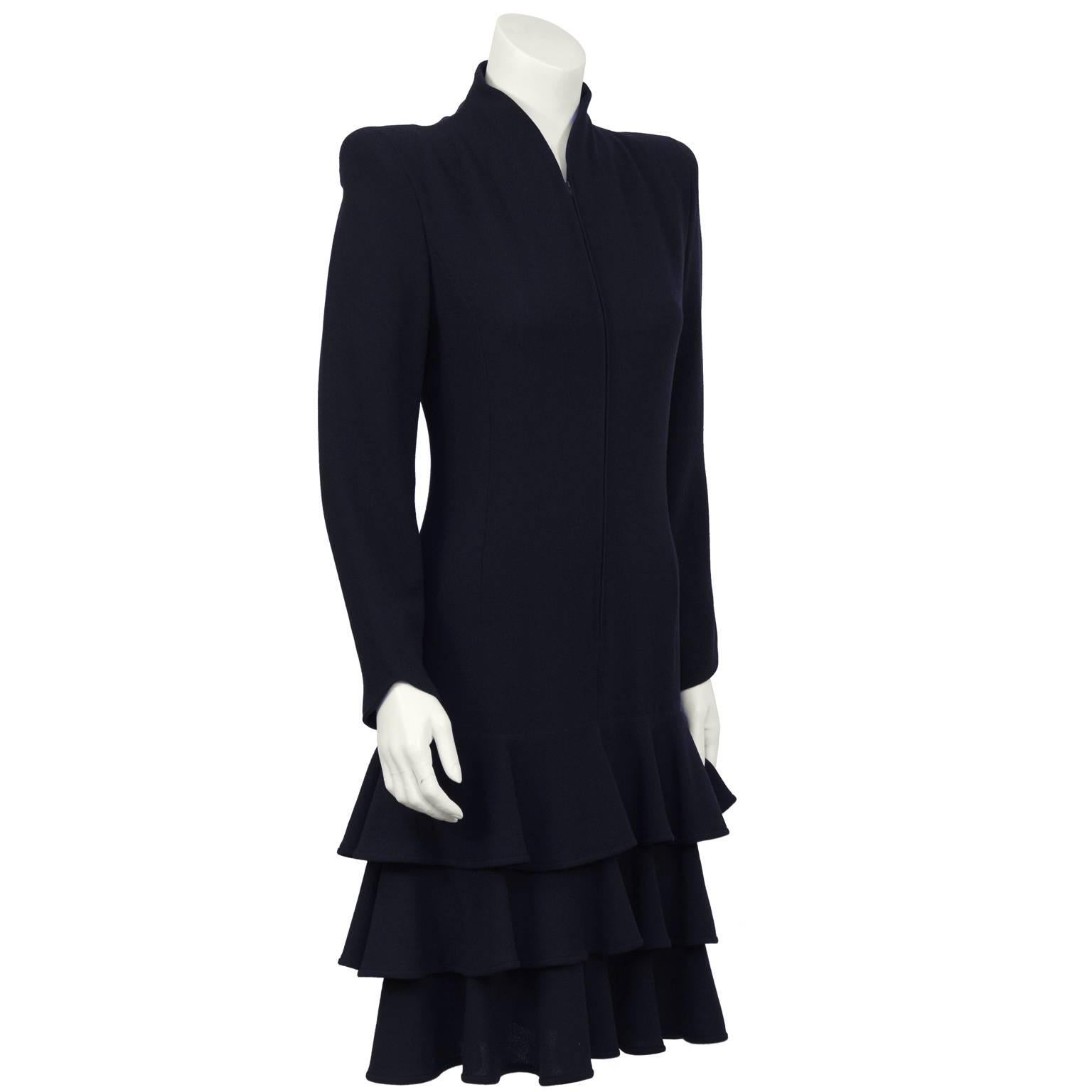 Valentino 1980’s navy drop-waist wool crepe dress with layered flounce skirt. The high collar and slightly padded shoulders give this dress great structure.  Does up with a long zipper down the front. Zippers at each wrist. Excellent condition. Fits