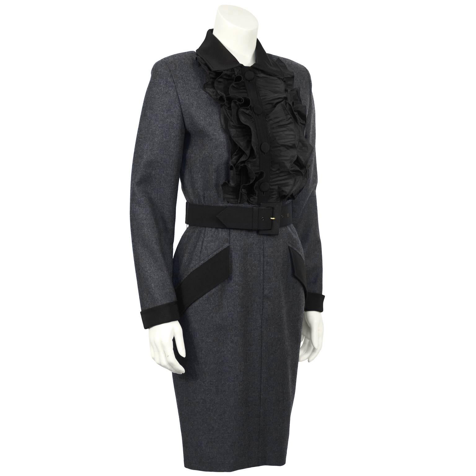 Valentino 1980's charcoal wool flannel belted dress. Sophisticated pleated silk ruffled jabot with wool placket and fabric covered buttons. The narrow skirt has a hidden zipper down the front. Topped off with a black fabric collar, cuffs and pocket