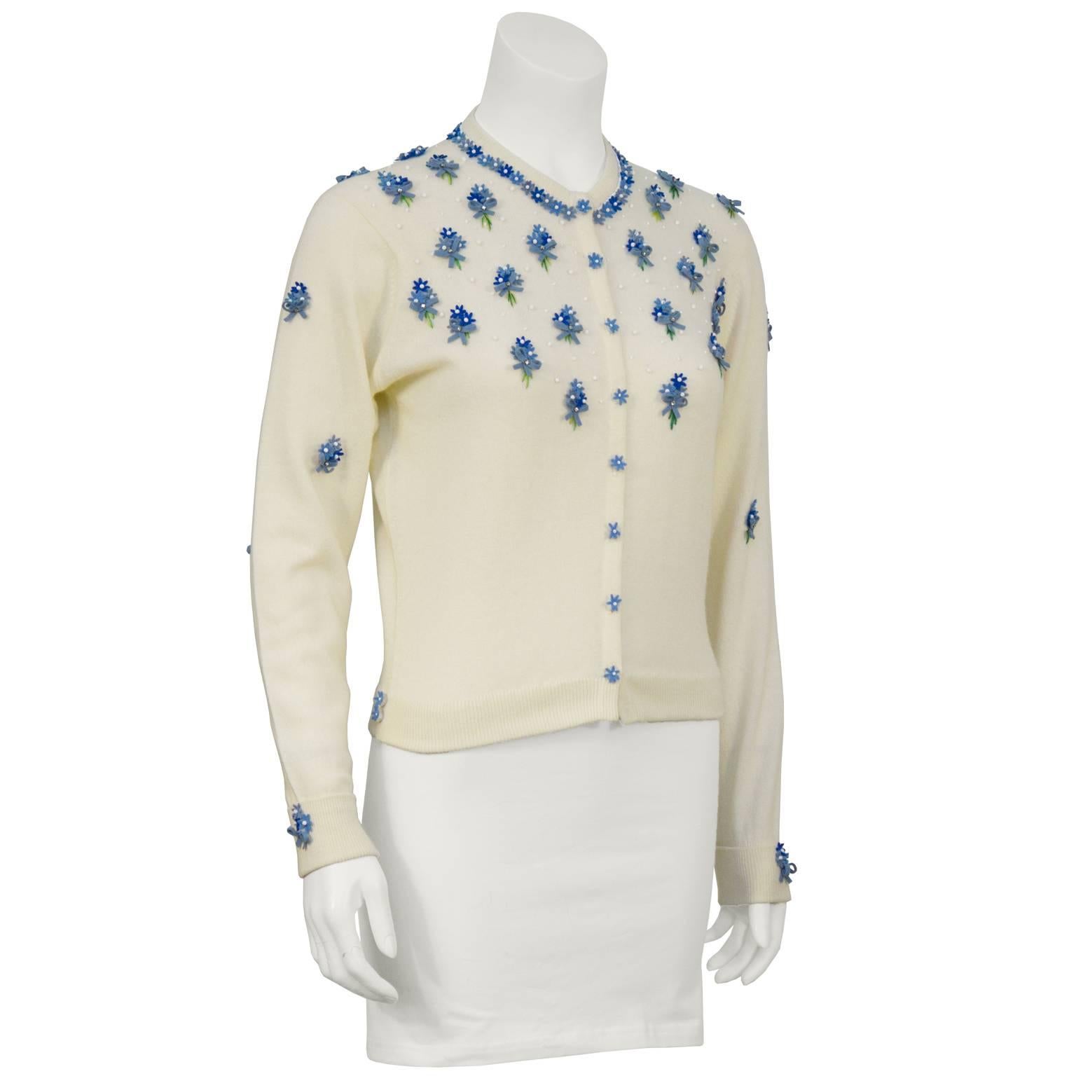 Pristine 1950's Pringle of Scotland 100% cashmere cardigan with hand-sewn white seed beads. Tri-colored blue felt floral appliqué bouquets around collar, sleeves, and on buttons. Perfect unworn condition. Fits like a US 4.
