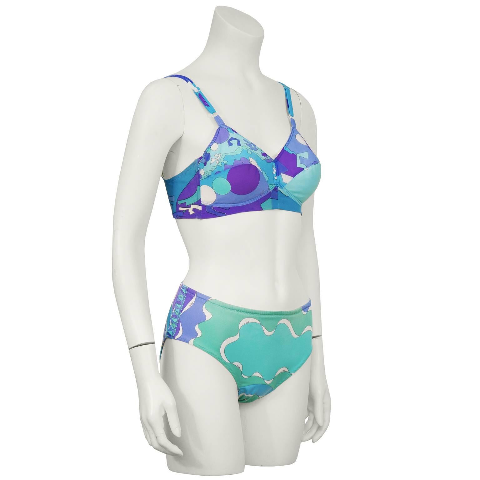 1970's Emilio Pucci for Formfit Rogers nylon bra and underwear set. The brassiere features a blue/green/purple geometric print with adjustable straps, padded cups and lycra mesh siding. Closes with a 2 hook adjustable closure. The full coverage