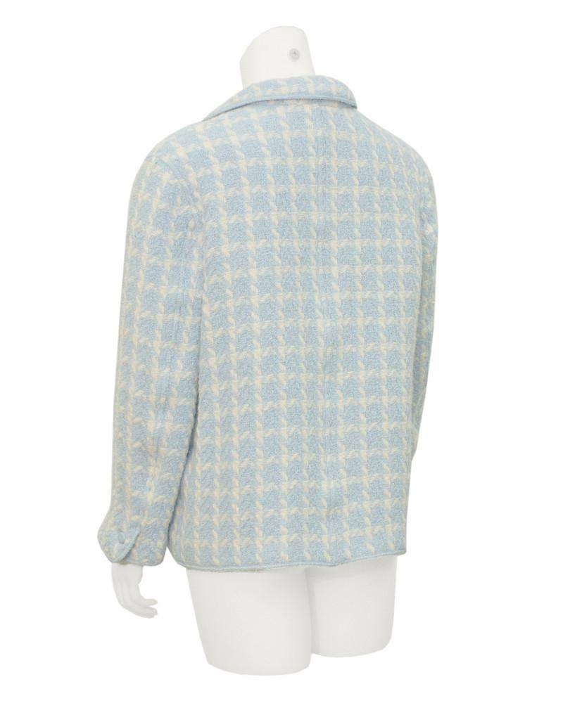 Adorable Chanel baby blue boucle houndstooth jacket from the SS 1996 collection. The rolled lapel and open front makes this jacket the perfect casual piece, ideal for throwing on over jeans and a simple white tee. Top flap pockets on the hips and