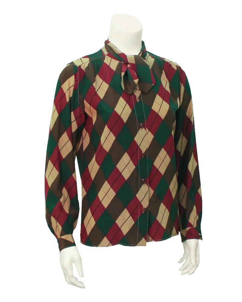 1970's silk Tiktiner argyle blouse in hunter green, brown, tan and maroon. Matching tan stitching throughout seams. Short tie at the neck and brown buttons down the front. Color combination is perfect for a preppy fall look. In excellent vintage