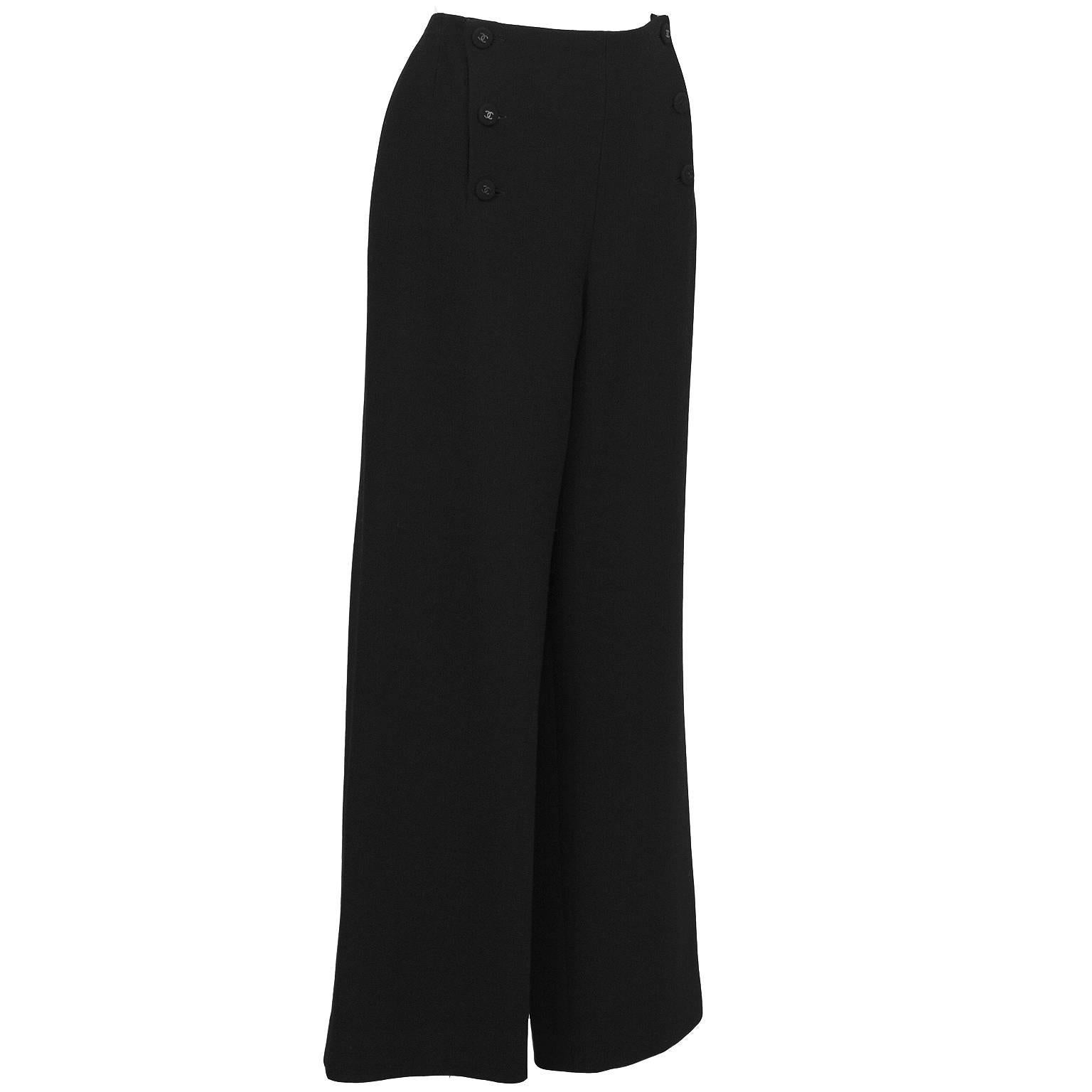 Chanel black sailor-style button front pants from the Fall 1997 collection. The pants feature a wide leg and fastens up the front with 6 fabric covered buttons with gunmetal black cc in the center. In excellent condition. Fits like a US 8-10. 