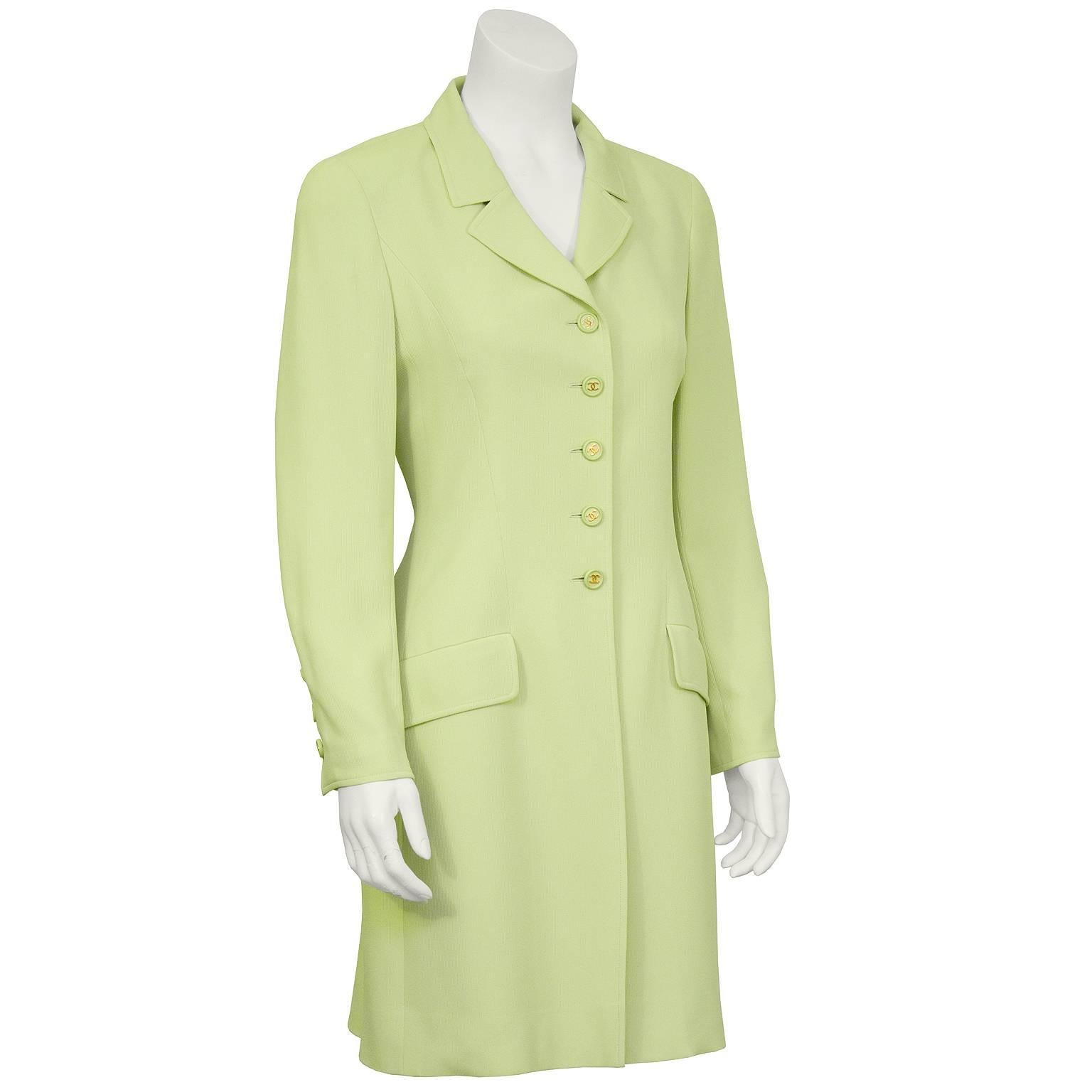 Chanel chartreuse silk-lined slip-style dress and long jacket from the Spring 1997 collection. The jacket has matching tonal CC buttons on the front as well as on the cuffs and two front flap pockets. The dress is fitted at the bust and has a seam