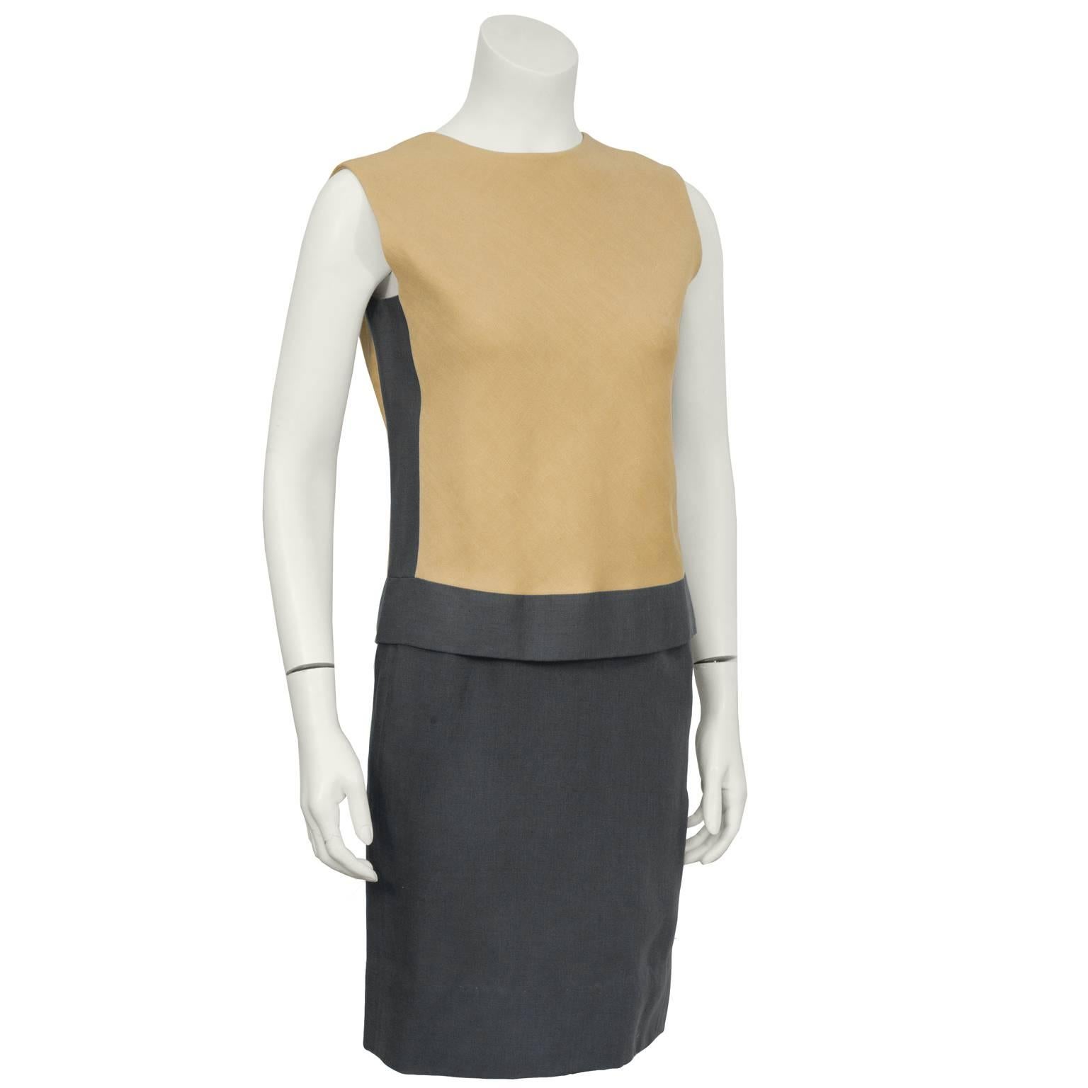 1960's chic sleeveless color block day dress in tan and grey linen with half linen, half rayon under dress. Teal Traina best known for his day and cocktail wear had a well established career in in the 60's and 70's. His minimalist and elegant pieces