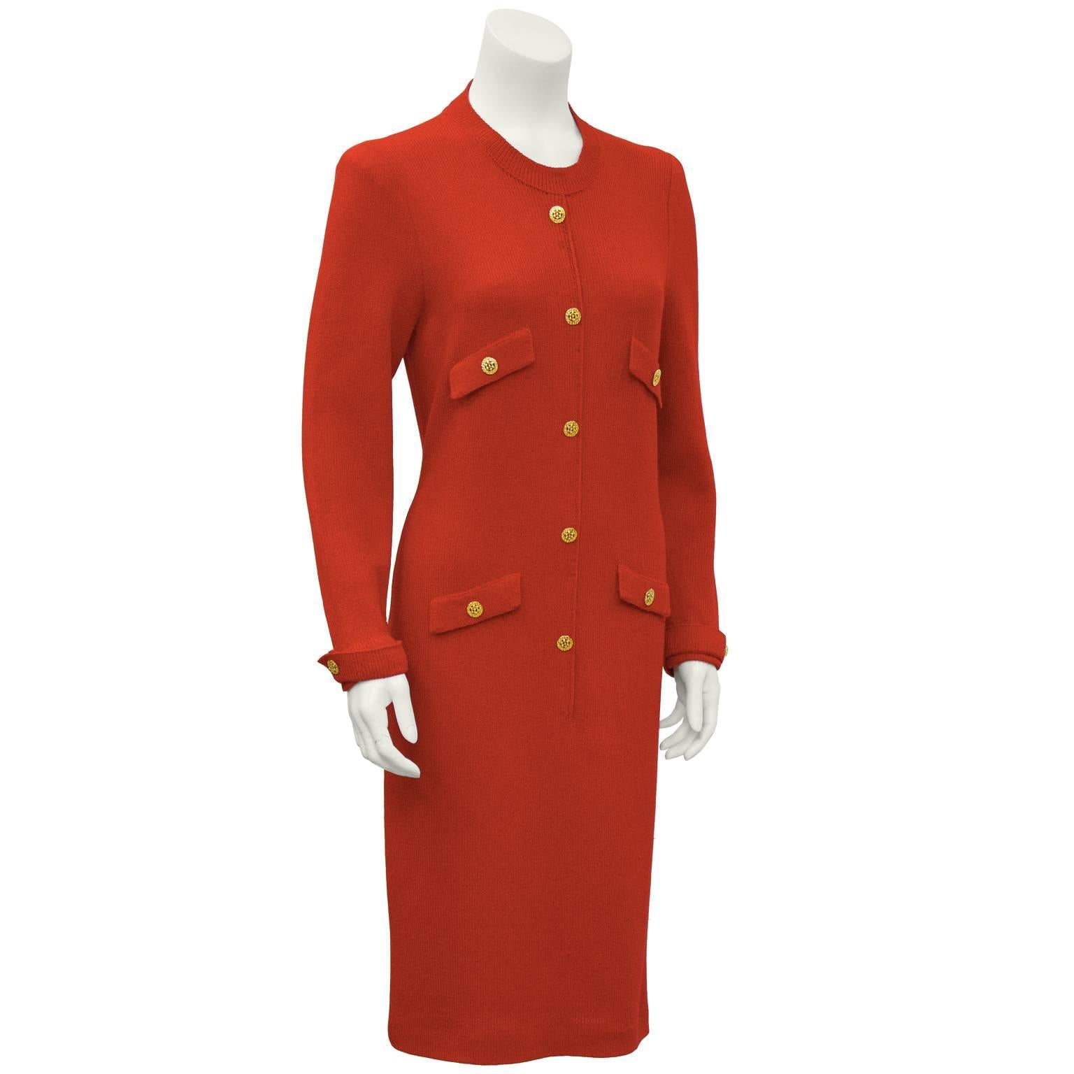 1970's Adolfo signature look red light weight boucle knit day dress. Ribbed collar, faux tabs on the cuffs and fron pocket flaps. Lots of gold plated buttons add detail to this simple back zip dress. Fits like a US size 8-10. Dry cleaned and ready