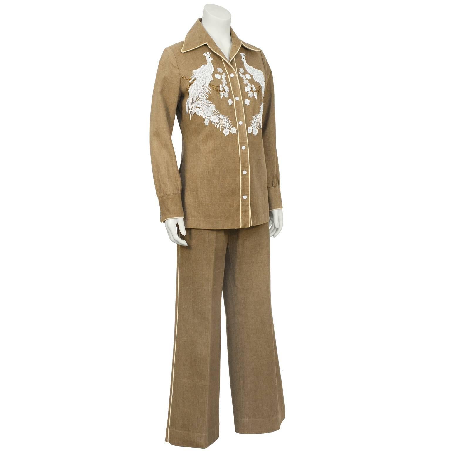 1960's ladies Western pant set in brushed brown denim with hand beaded white and silver peacocks seated on gold beaded branch. Not for the timid! In excellent condition piped in contracting soft yellow with all the bells and whistles of a fine
