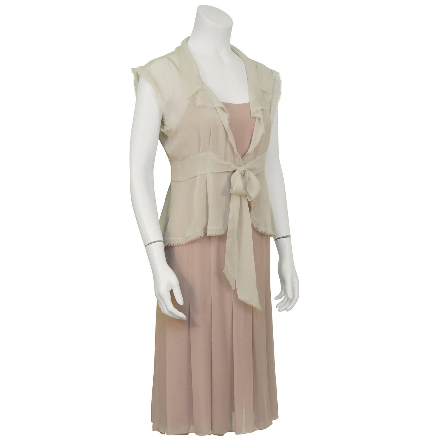 Chanel spring 2004 soft taupe and celadon green silk chiffon 2pc cocktail set. Sleeveless raw edged jacket  with soft single lapel and self tie at waist, unlined. Coordinating sleeveless dress in pale taupe, spaghetti strap, fully lined with