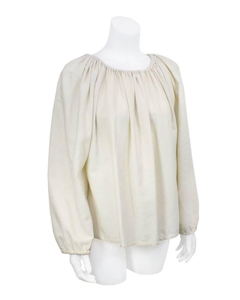 Peasant style Lanvin 1970's top in natural woven cotton and linen. Almost impossible to imagine that this timeless piece is 30 + years old. This looks more like runway Spring 2013. In excellent condition, loose elasticized gather at the wrists, pull
