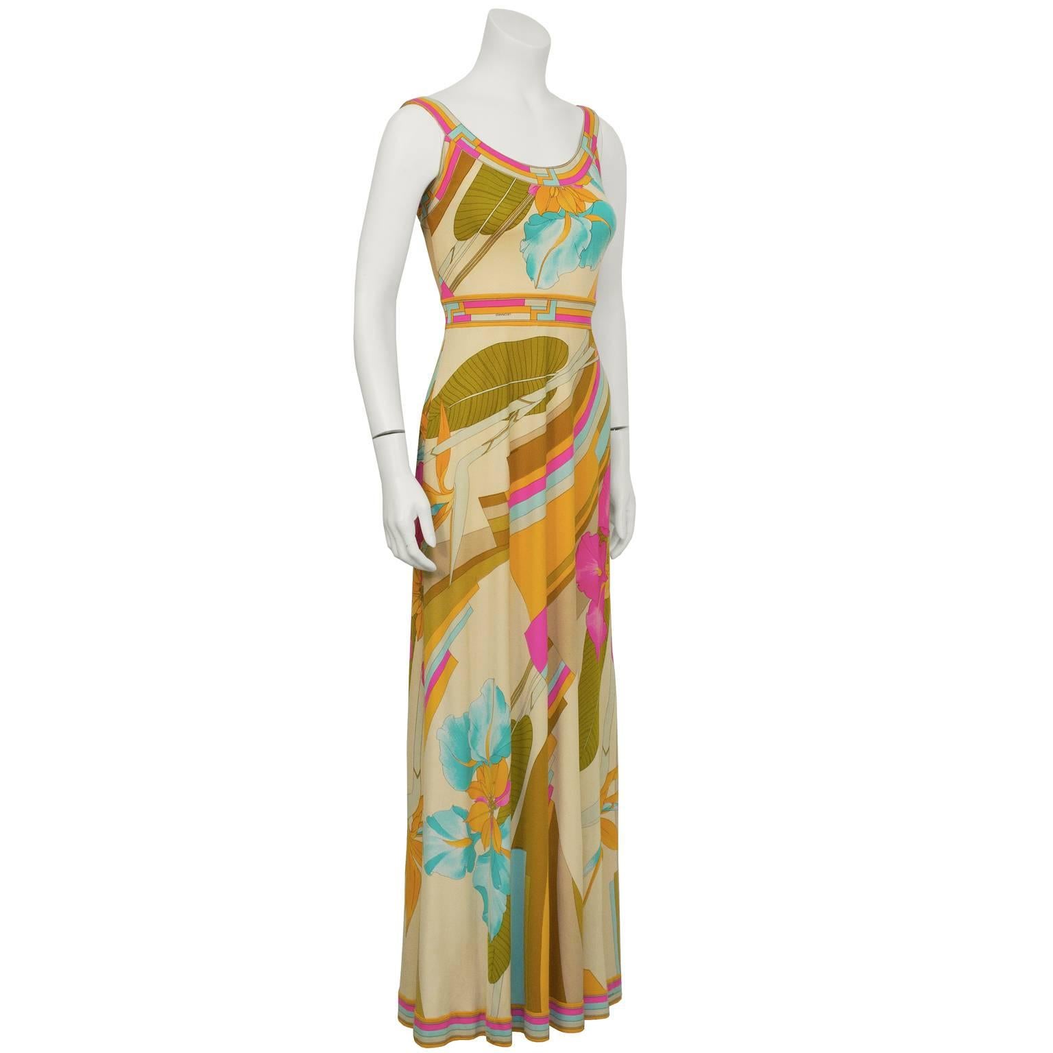 Stunning 1970's pastel pinks, orange and blue Leonard maxi dress with floral and geometric graphic print on soft tan background. Summery U shaped neckline and straps with deep V back and zipper close. LIke similar Pucci pieces it is signed fabric in