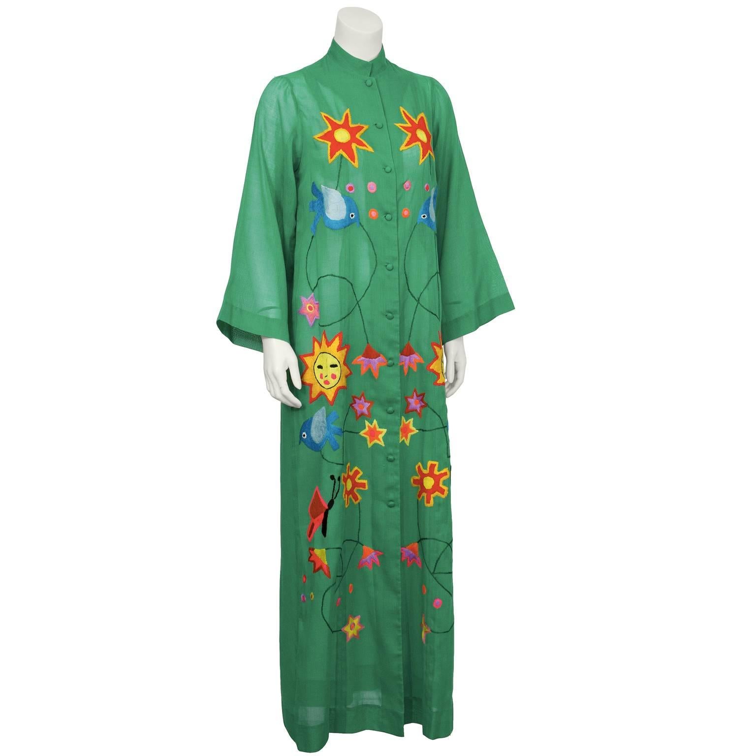 Anonymous green maxi dress with embroidery from the 1960’s. This dress is the perfect mix of boho with a Mexican vibe and the embroidery is in impeccable condition. Featuring stars, birds, suns, insects and flowers, the vibrant colors on the green
