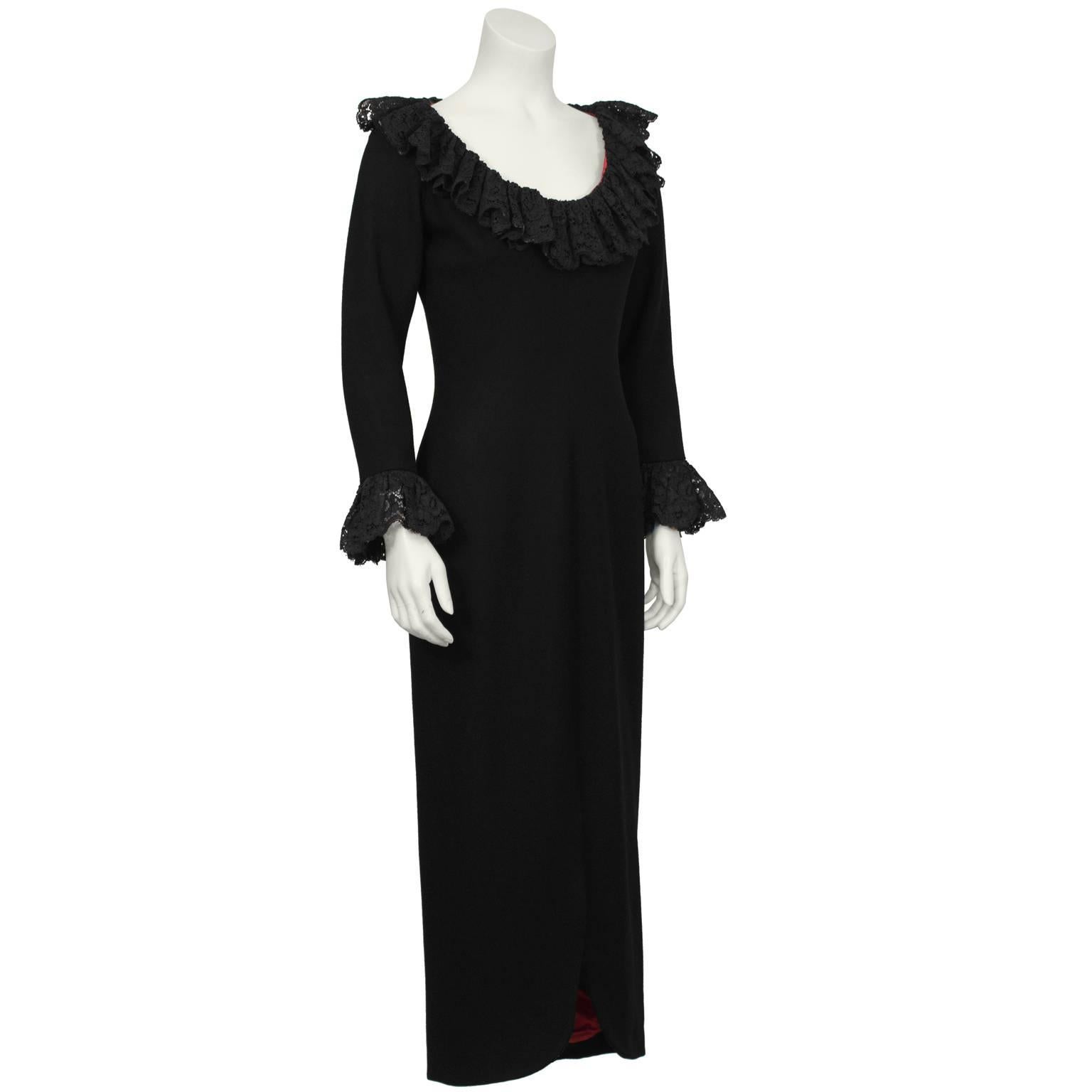 Beautiful and dramatic Spanish inspired black wool gown with lace at the neckline and cuffs. The dress has a U shaped neckline trimmed in exquisite black lace. The bracelet length sleeves are trimmed in matching lace. Form fitted through the waist