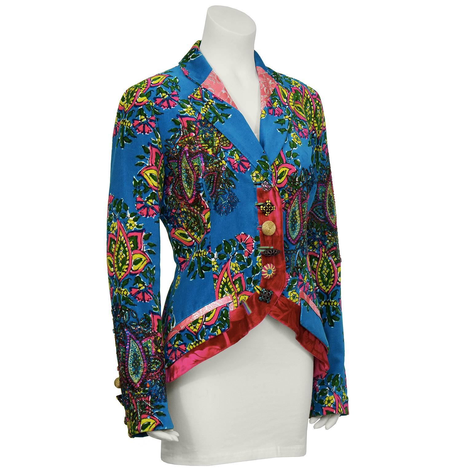 Kenzo 2005 Fall runway velvet blazer with beadwork and brocade accents. The jacket is blue and pink paisley fabric with beaded paisley accents on the arms, bust, and back. Jacket fastens down the front with mismatched style buttons and cuts away