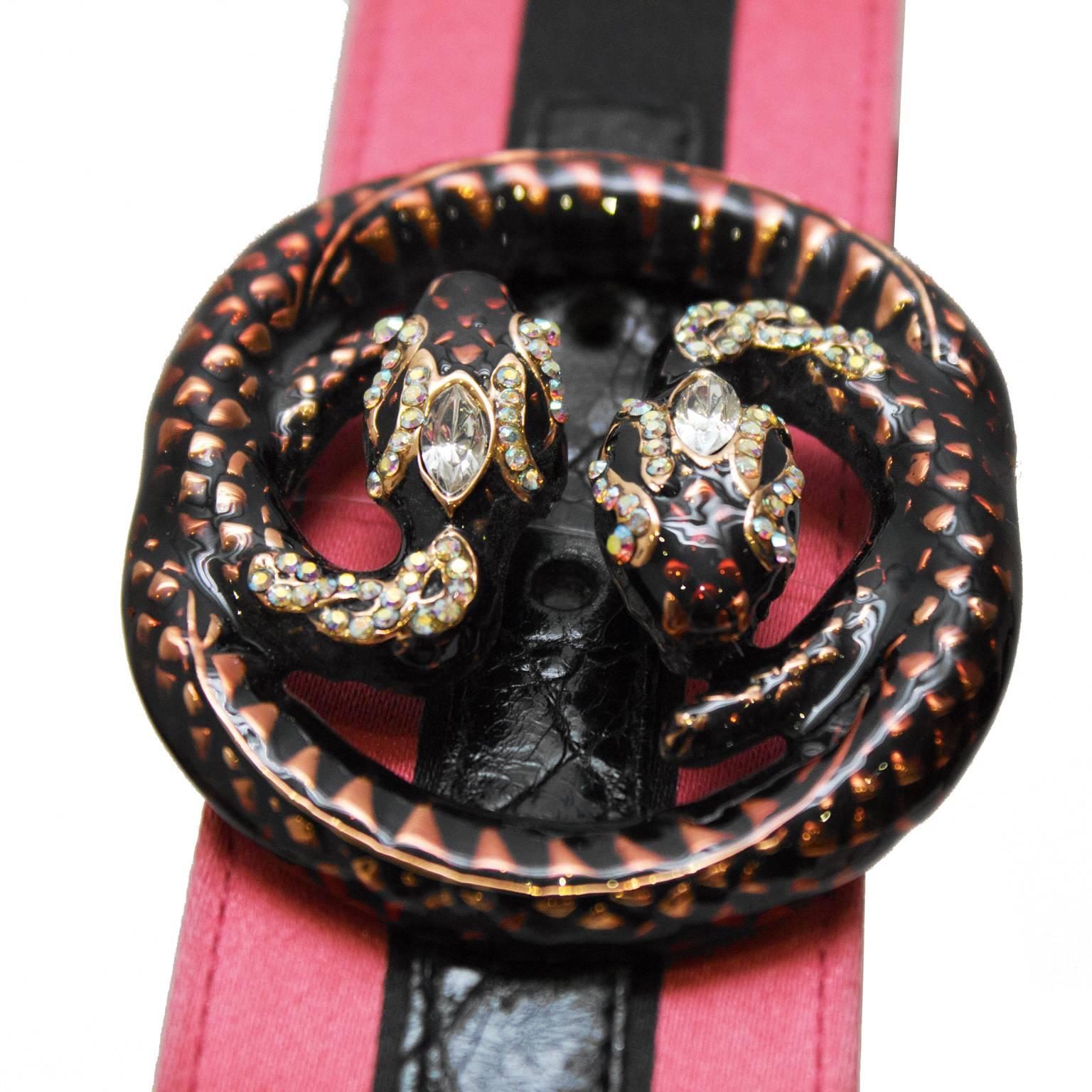 Gucci pink satin and black crocodile belt from the Tom Ford era. The belt features a unique enamel and rhinestone double snake buckle in the shape of the Gucci logo revived from the Gucci archives. The belt is adjustable. No signs of wear to the