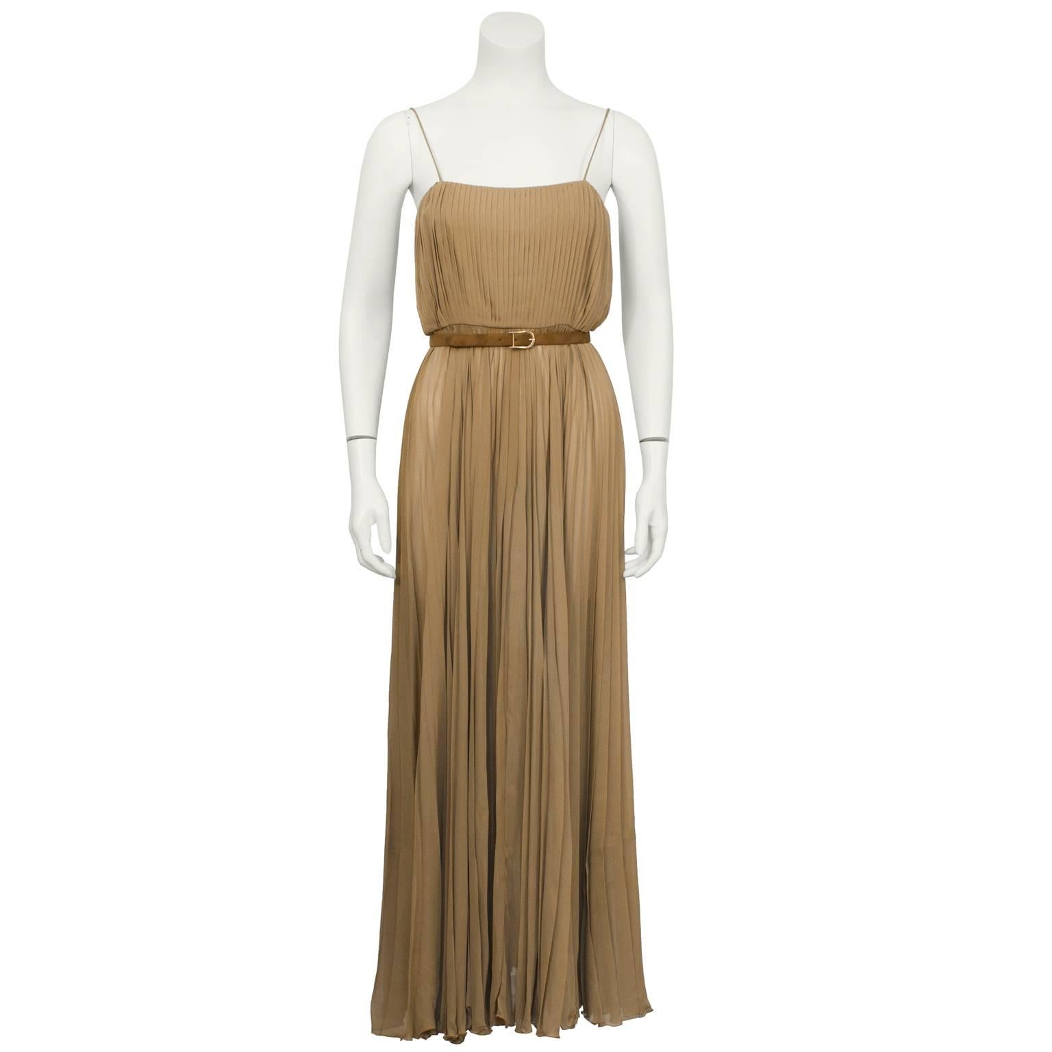 Bill Blass (label missing) 1970's pleated mocha chiffon evening gown. The gown has spaghetti straps and an unlined skirt. Zips up the back and has a matching skinny mocha suede belt with gold buckle to be worn at the empire waist. In excellent