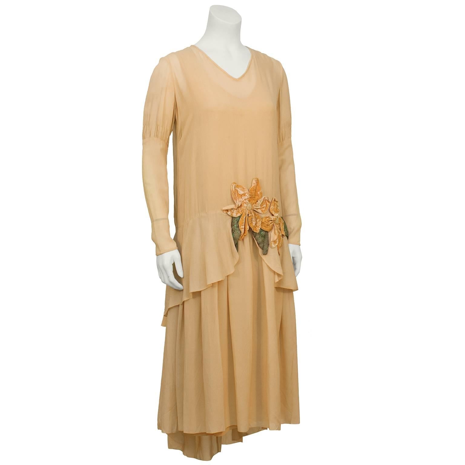 Beautiful dressmaker made 1920's peach silk chiffon and panne velvet flapper dress with matching cloche hat. Long sleeves with 3 tiers of chiffon and lace inset on the back with a velvet tie. The front has a tulip tier and velvet applique flowers.