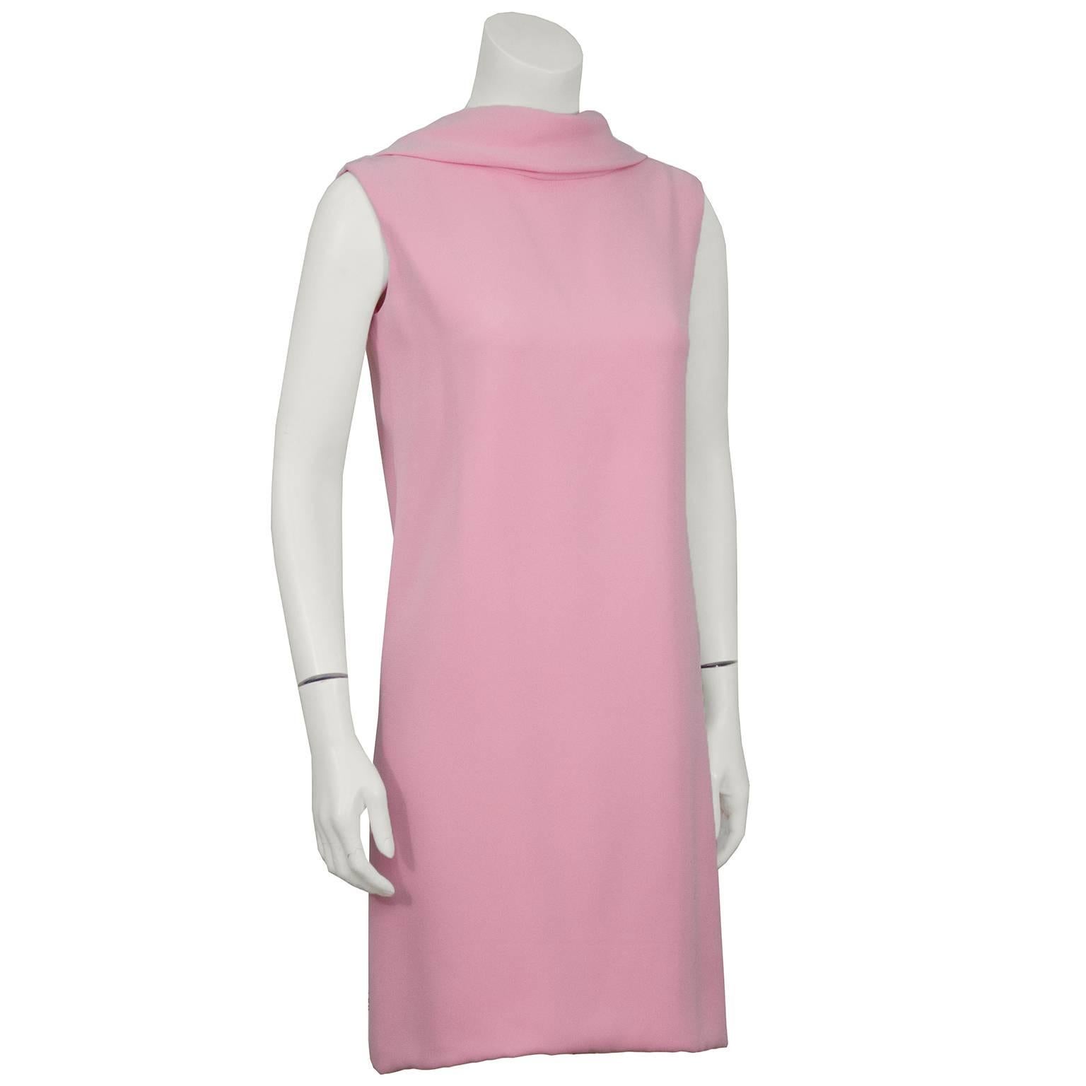 Baby pink Norell silk scoop back dress from the 1960's. The neckline is high in the front and dips low in the back. Folded collar and sleeveless, this dress is snug in the hips. In excellent condition, some minor fade to the fabric due to age. Fits