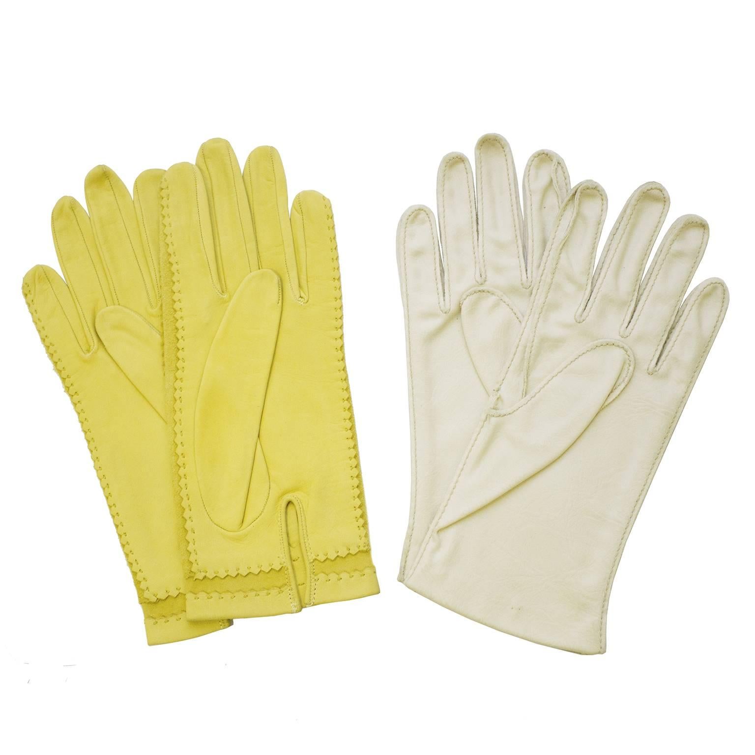 Two pairs of gloves from the 1960's. The first pair have a bright yellow leather top and bottom with cotton inserts, allowing the hand to move freely. The second pair have a cream leather bottom and a cream, brown and tan color blocked vinyl top.
