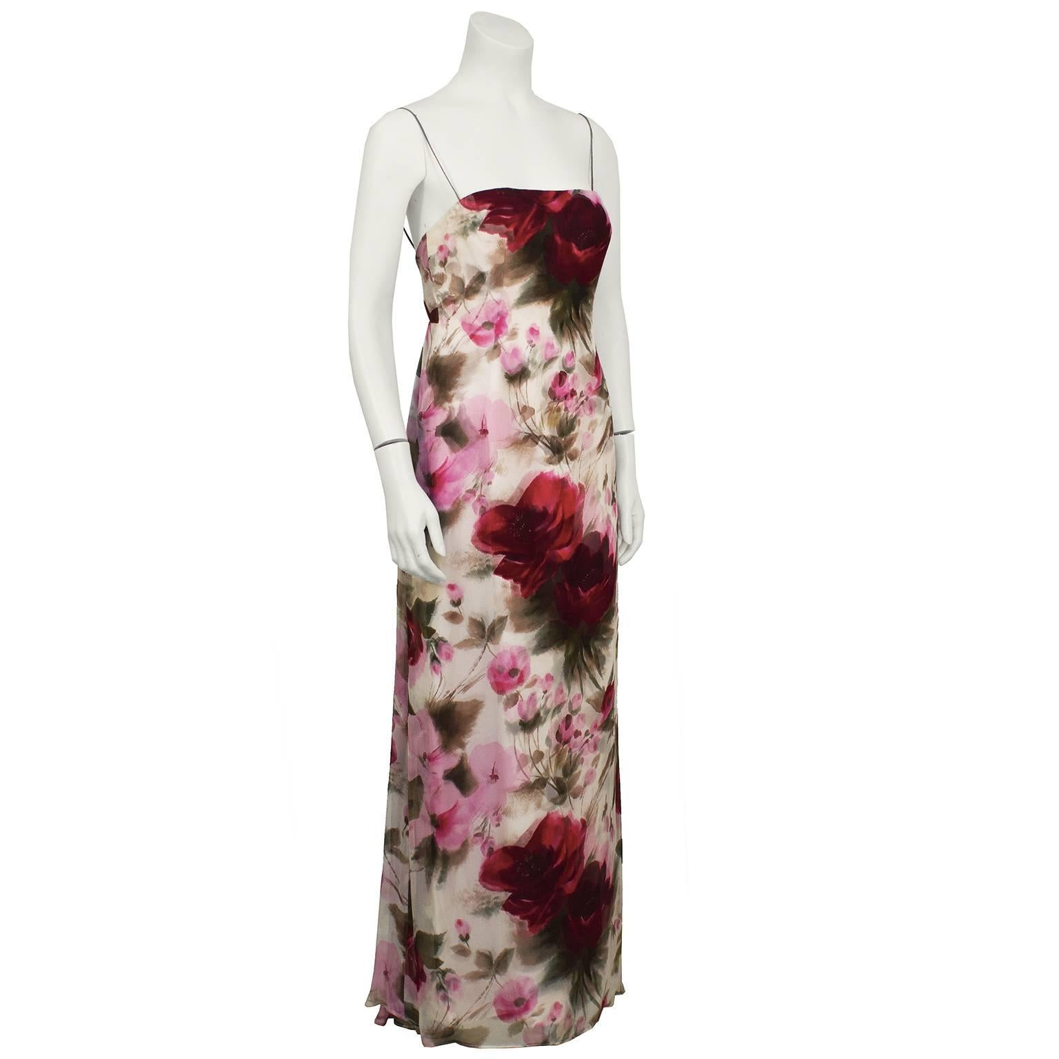 1970's Helena Barbieri pink and red floral printed evening gown. Spaghetti straps, chemise style neckline, chiffon layer falls from the natural waist with gathering in the back. Large rose floral print down the front of the dress. Zips up the back,