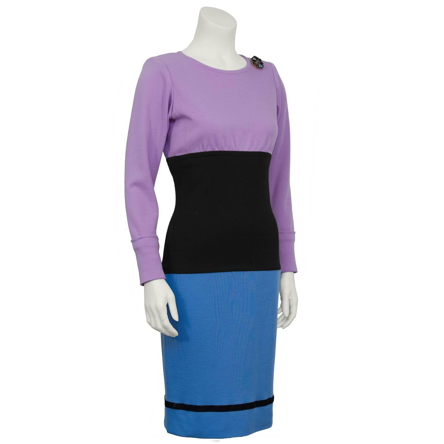 Yves Saint Laurent YSL colorblock day dress from the 1980's. Lavender bust and long sleeves, black waist and light blue skirt. The wool jersey dress is fitted through the waist with banded cuffs, four black buttons up the back and black and gold
