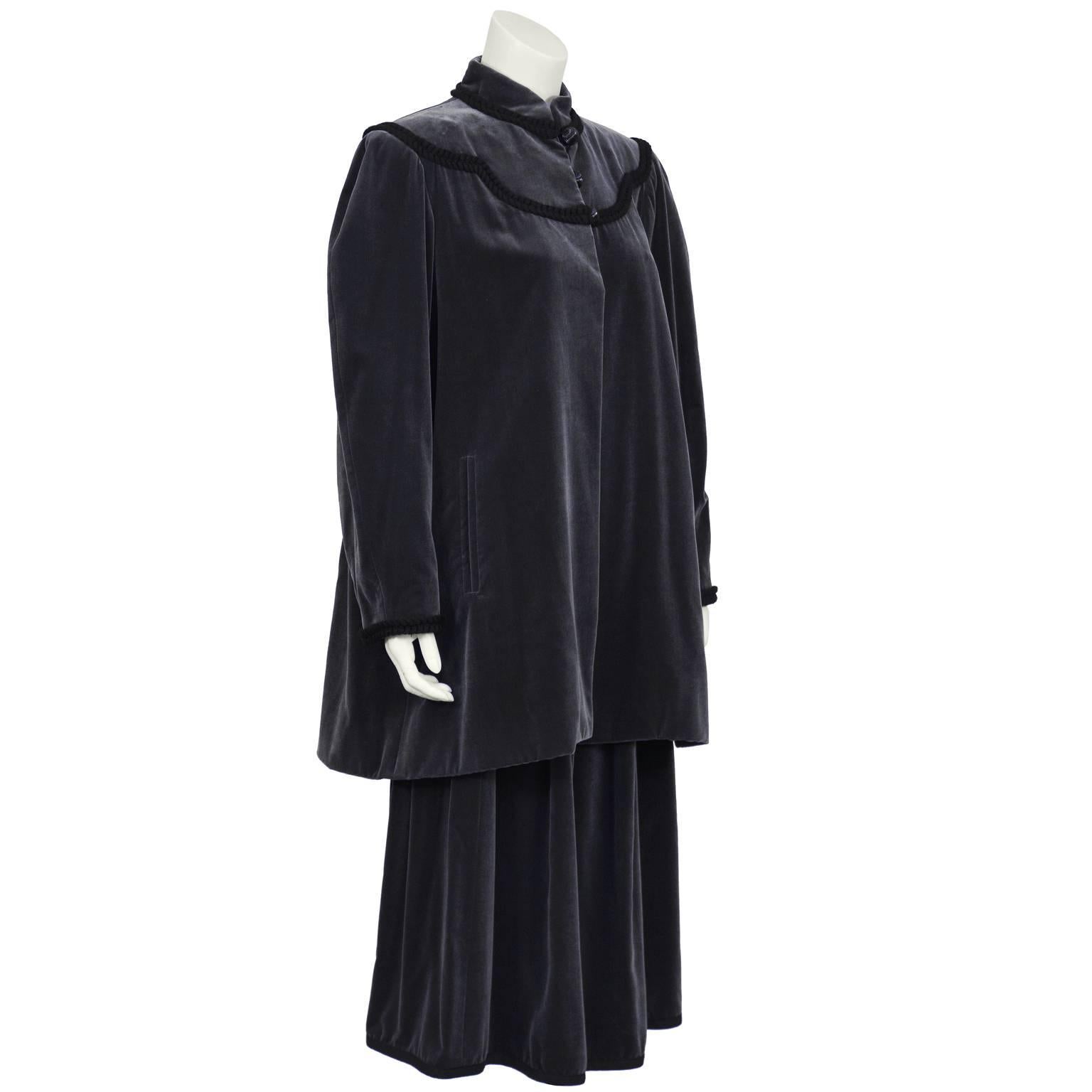 1970's YSL gunmetal grey velvet 2 piece ensemble from the Russian RTW collection. Full cut gathered skirt with black braided trim. Matching loose fit jacket trimmed below collar and around front and back yoke with black braided cord. Can be worn