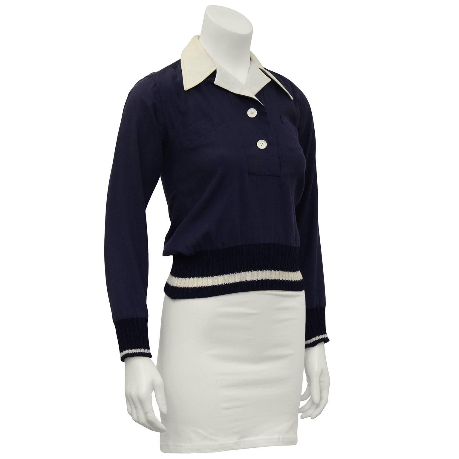 Margaret Howell navy wool gabardine pull over top from the early 1970's. Crisp cream notched collar, two white button opening at the collar. Two slit pockets on the bust and navy and cream knit ribbed cuffs and hem. In excellent condition. Fits like