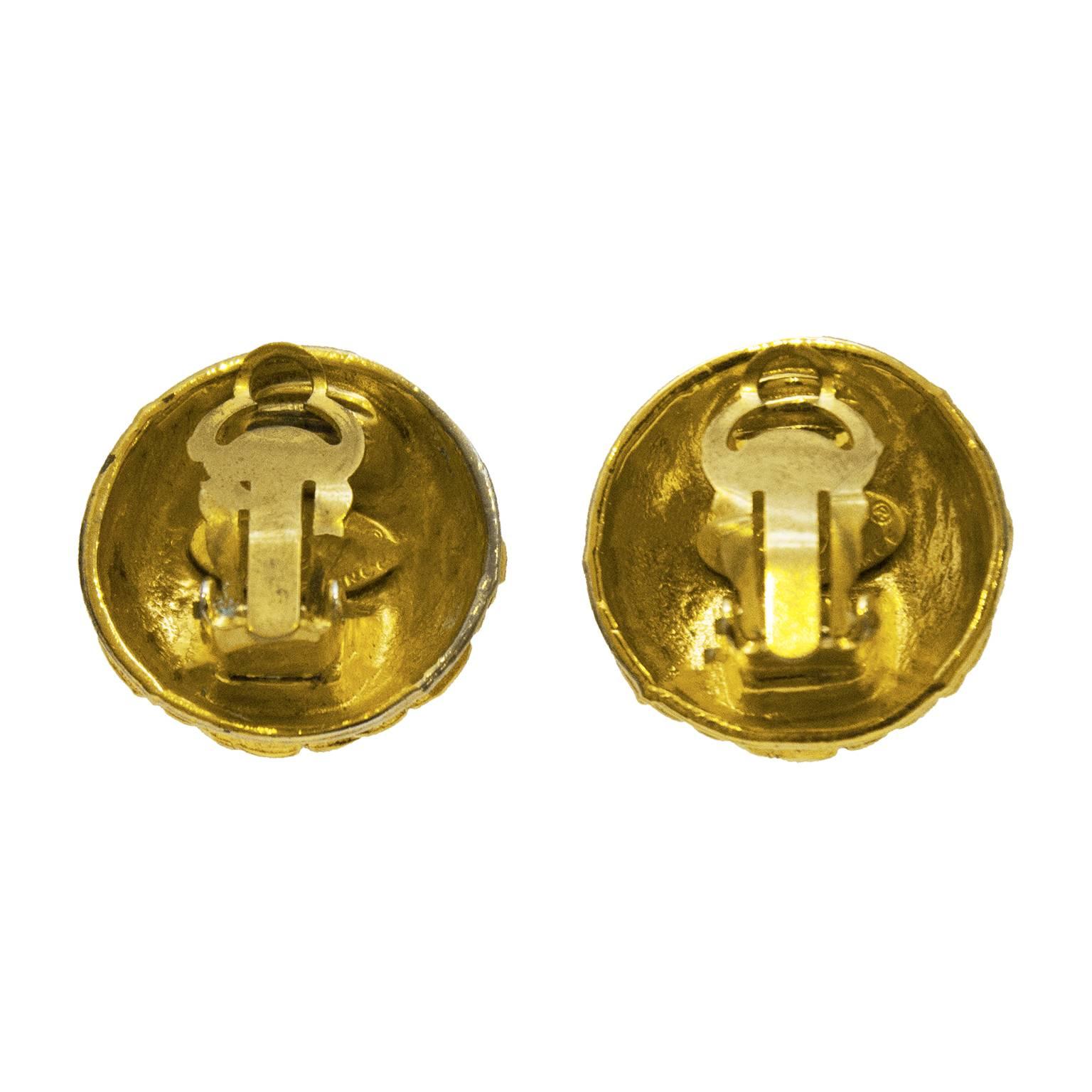 Chanel goldtone quilted texture clip on style earrings from the early 1980's. The round earrings have a CC at the center and are marked collection 25 on the underside. In excellent condition, a classic that never goes out of style. 