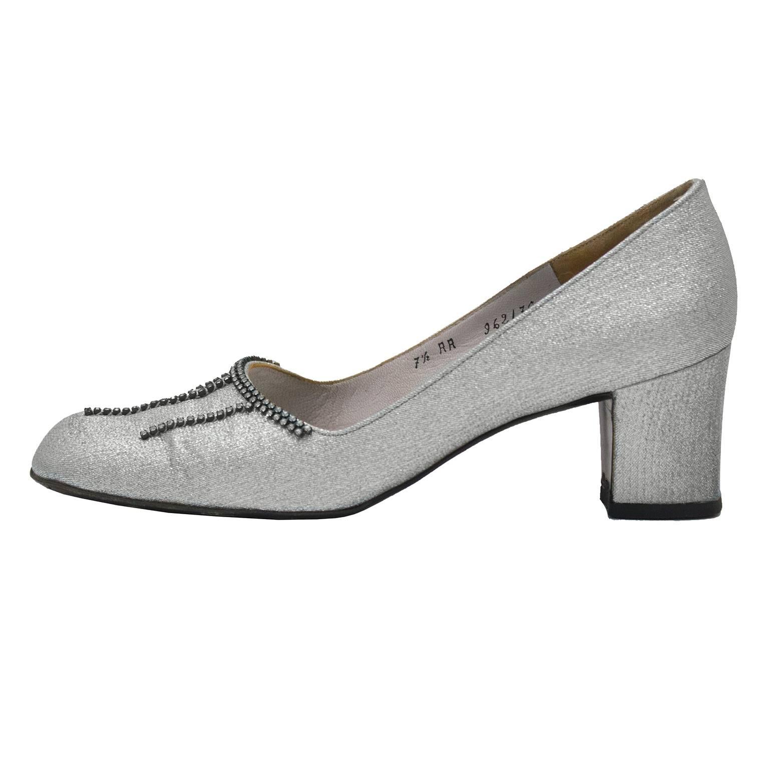 Christian Dior Souliers couture silver brocade round toe chunky heels from the 1960's. The toe of the shoes feature diamante detail and the insole is covered in a matching silver leather. Covered low heel with slight signs of wear. Marked a 7.5 AA 