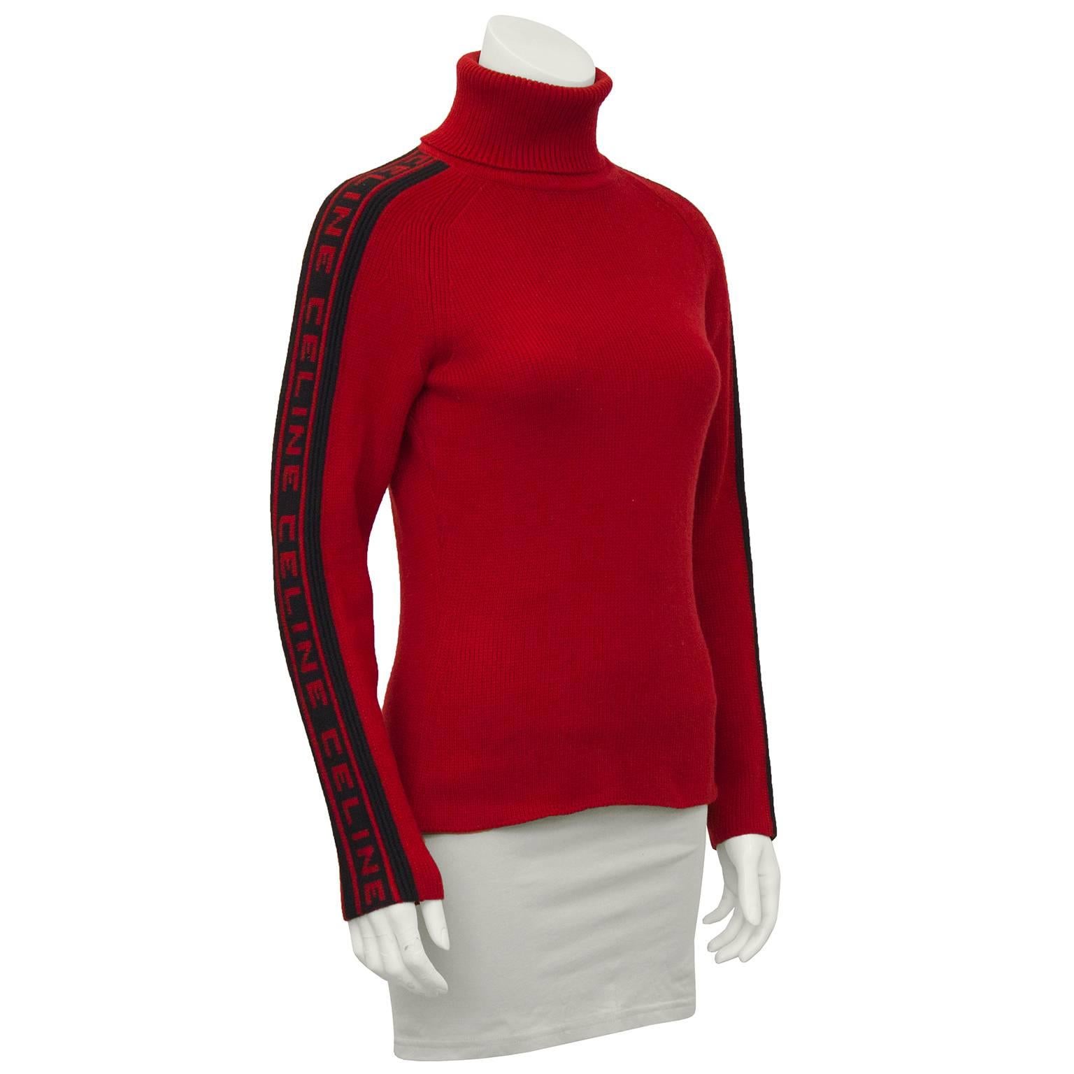 As featured in the F/W 1999 ad campaign worn by Gisele. 100% cashmere red and black ribbed turtleneck with CELINE patterned in black up both narrow ribbed arms. The perfect apres ski look or paired with your favorite jeans, it doesn't get better for