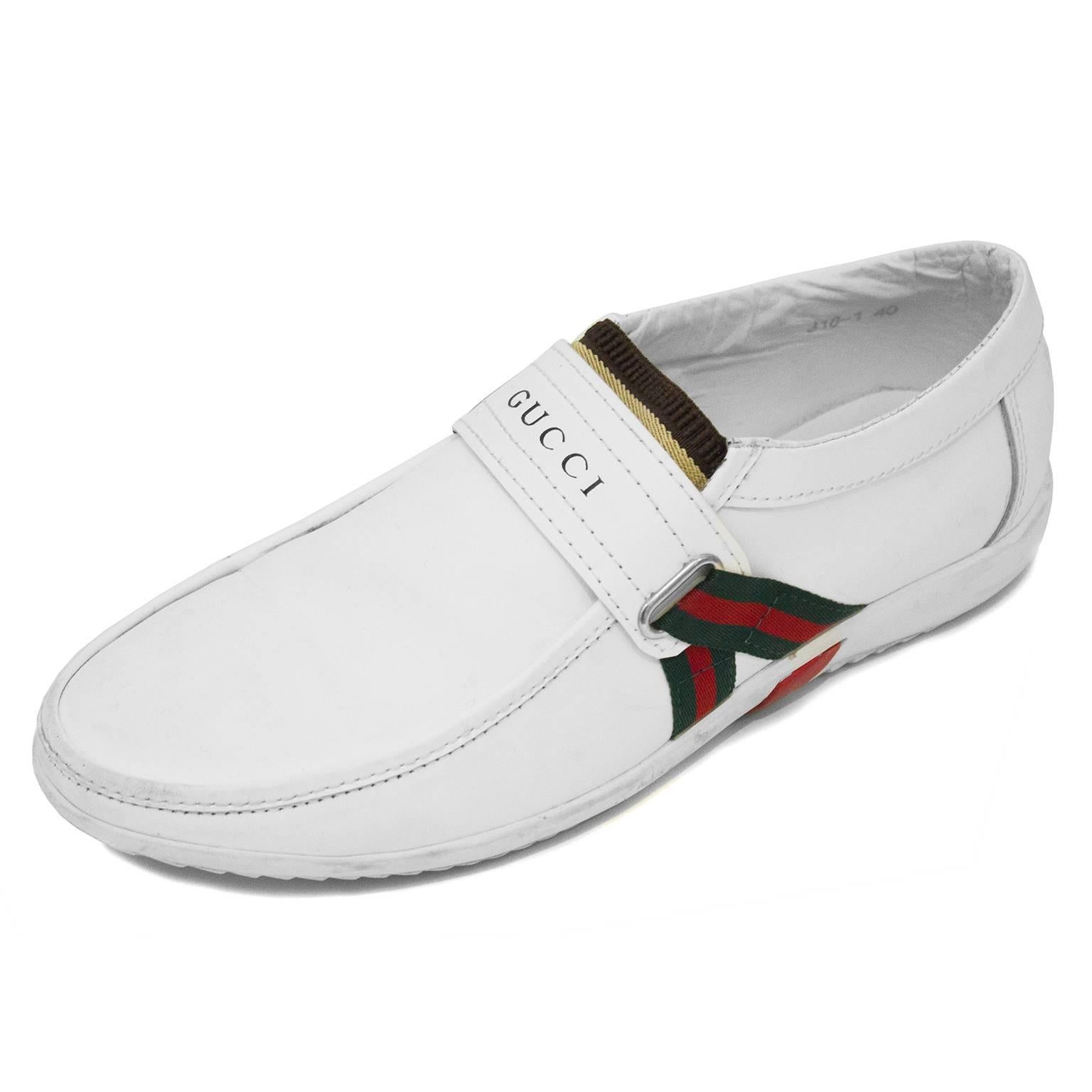 Gucci 1970's small fitting mans runner in white leather with white rubber sole. Unique red and green ribbon detail on the sides with a stretchy band on this loafer style slip on. Size is Italian men's 7. Will fit a US ladies 9. Very comfortable, not
