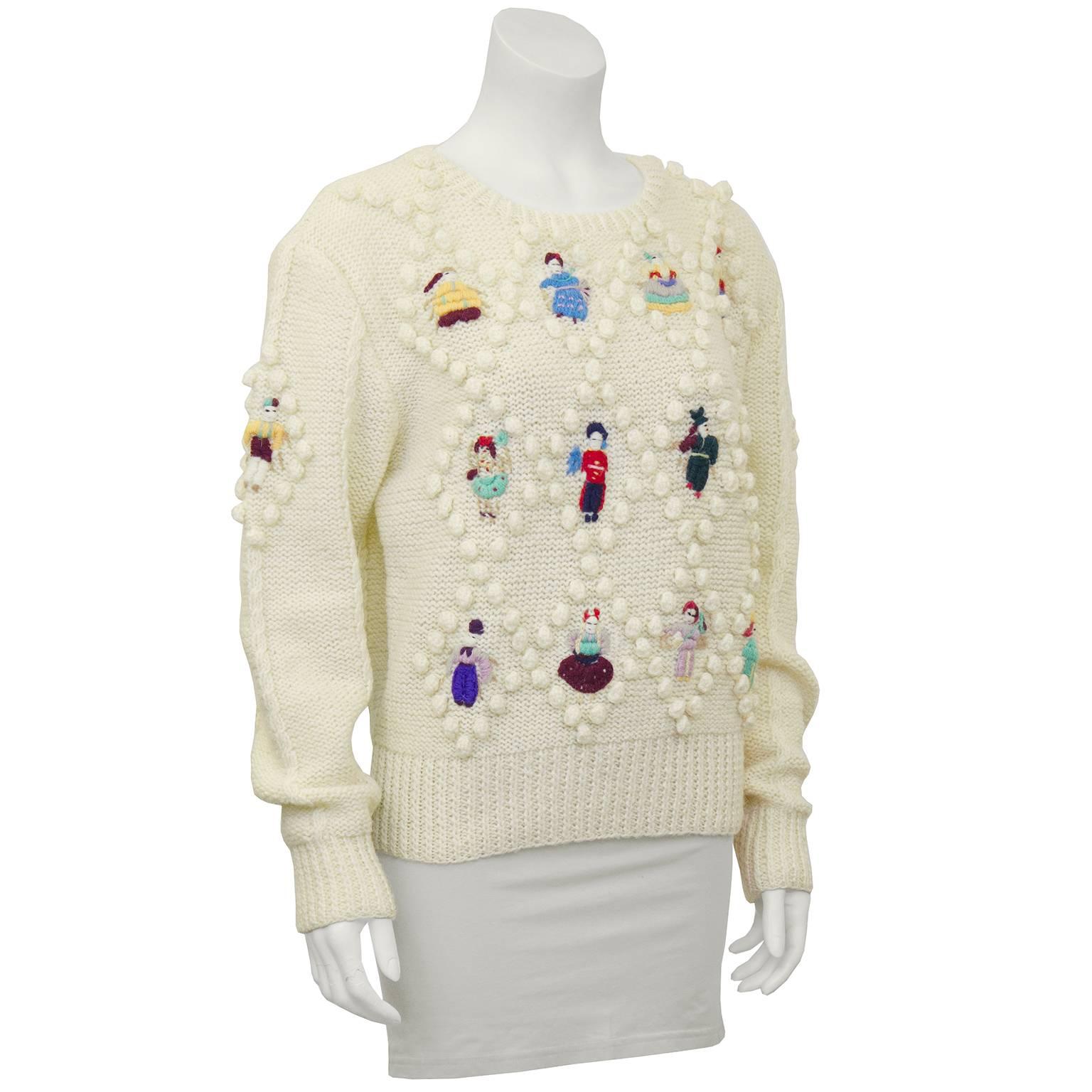 80s cream wool cable knit sweater with folklore doll hand embroidered details throughout. Excellent vintage condition. Marked size L, fits like US 6-8.